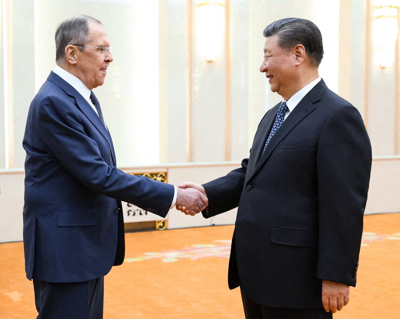 Russian Foreign Minister Sergei Lavrov greets with Chinese leader Xi Jinping in Beijing on Tuesday. Photo: Russian Foreign Ministry/Handout via Reuters