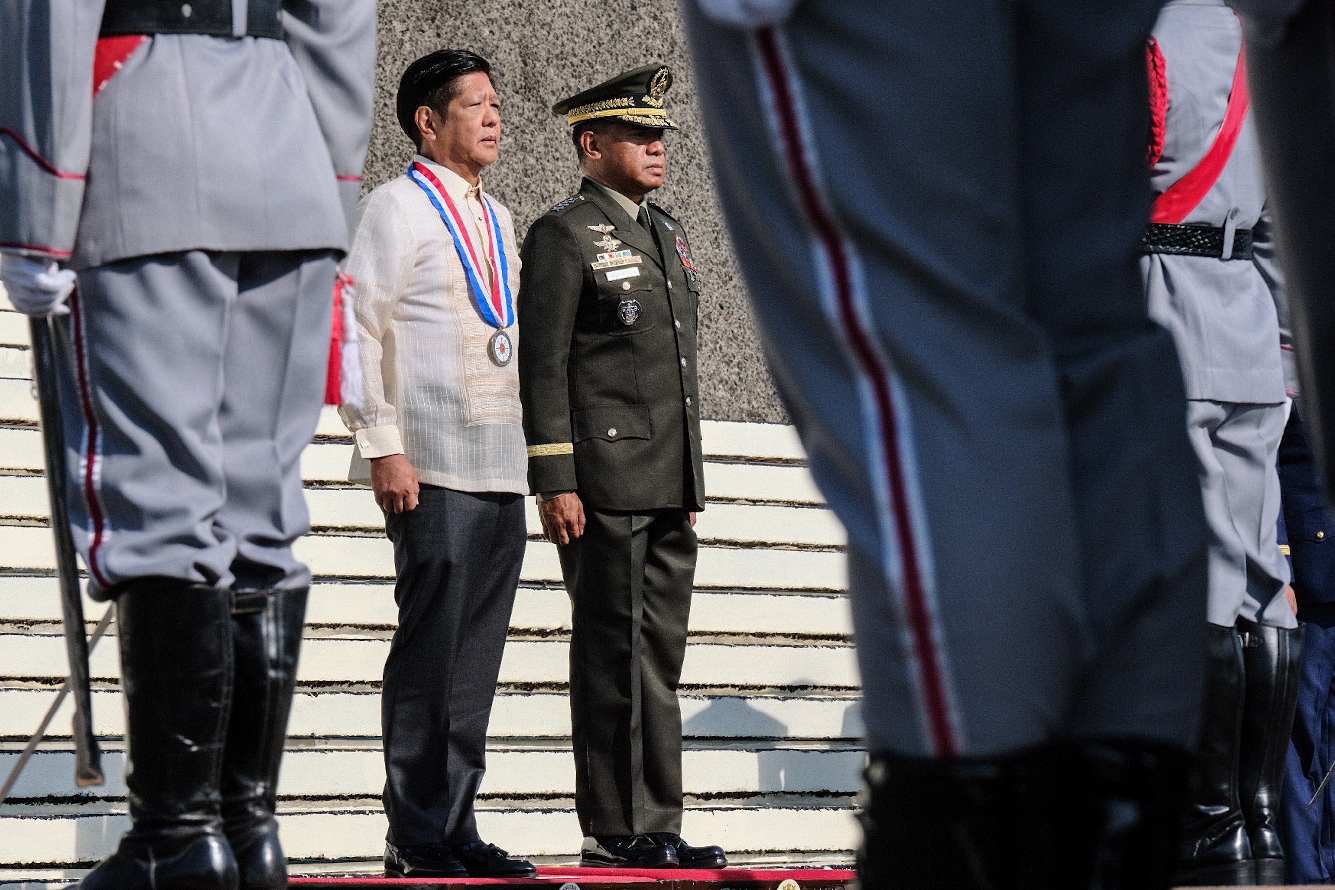 Philippine President Ferdinand Marcos Jnr (left) stands with armed forces chief General Romeo Brawner as they mark the ‘Day of Valor’ in Bataan province on Tuesday. Marcos Jnr’s own website has reportedly been targeted by hackers. Photo: EPA-EFE