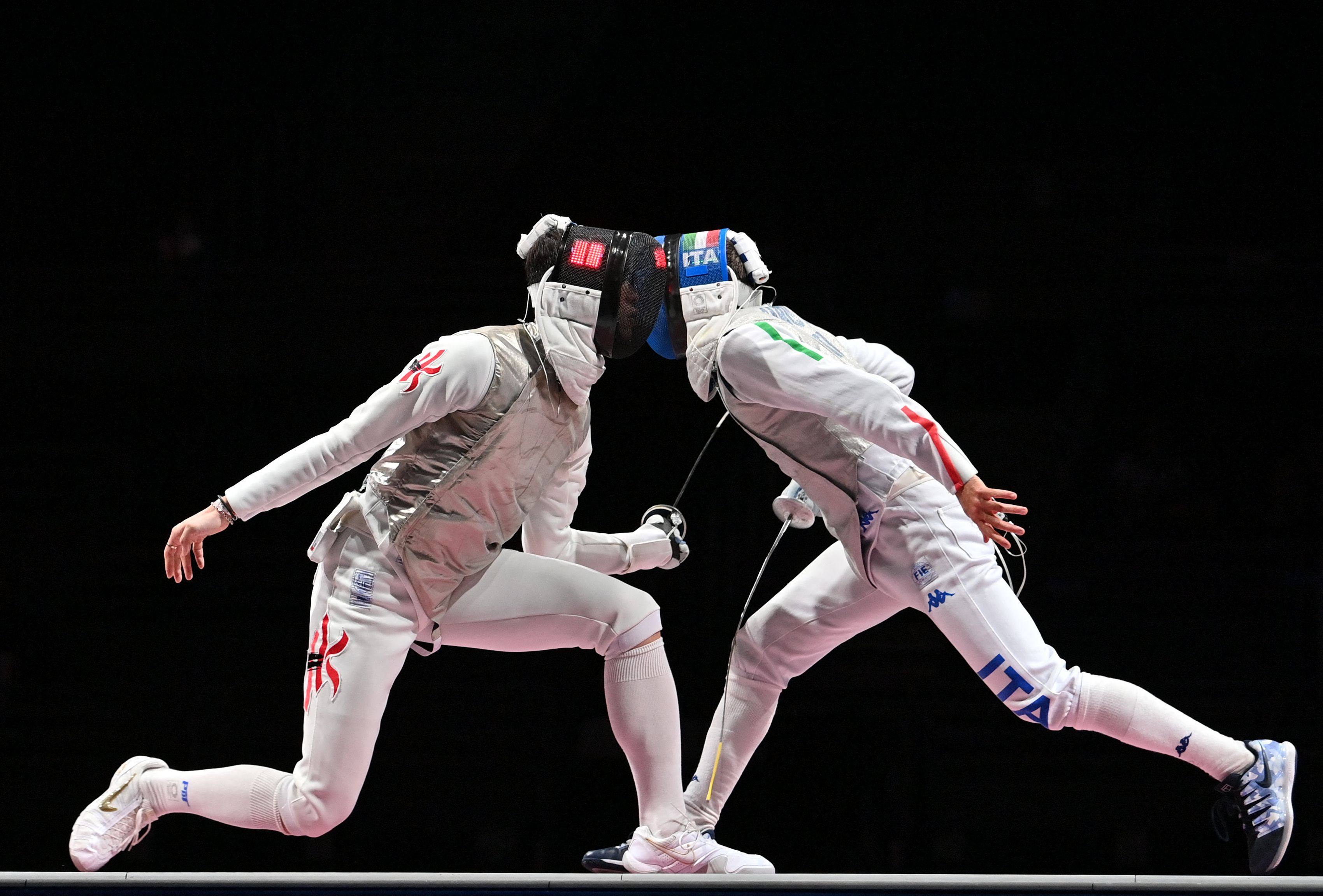 Hong Kong’s Cheung Ka-long (left) competes against Italy’s Daniele Garozzo in the men’s individual foil gold medal bout at the Tokyo 2020 Olympic Games. Photo: AFP