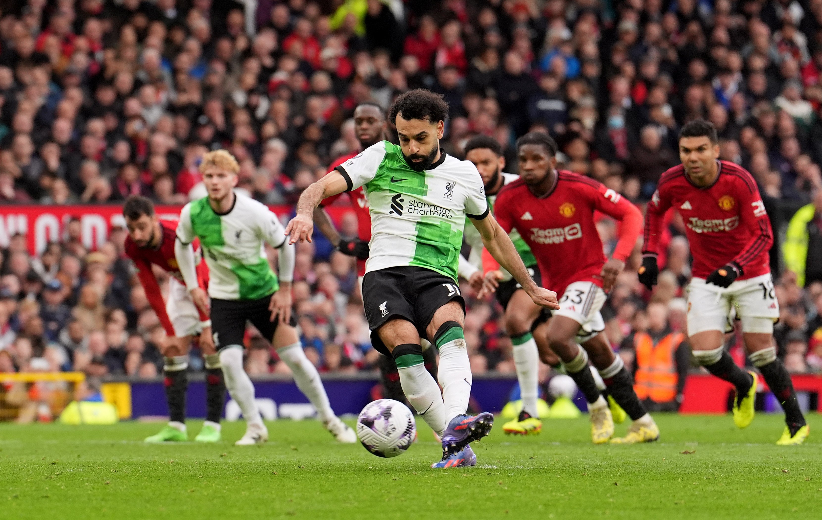 Liverpool’s Mohamed Salah scores his team’s second goal of the game during their English Premier League soccer match against Manchester United. Photo: dpa