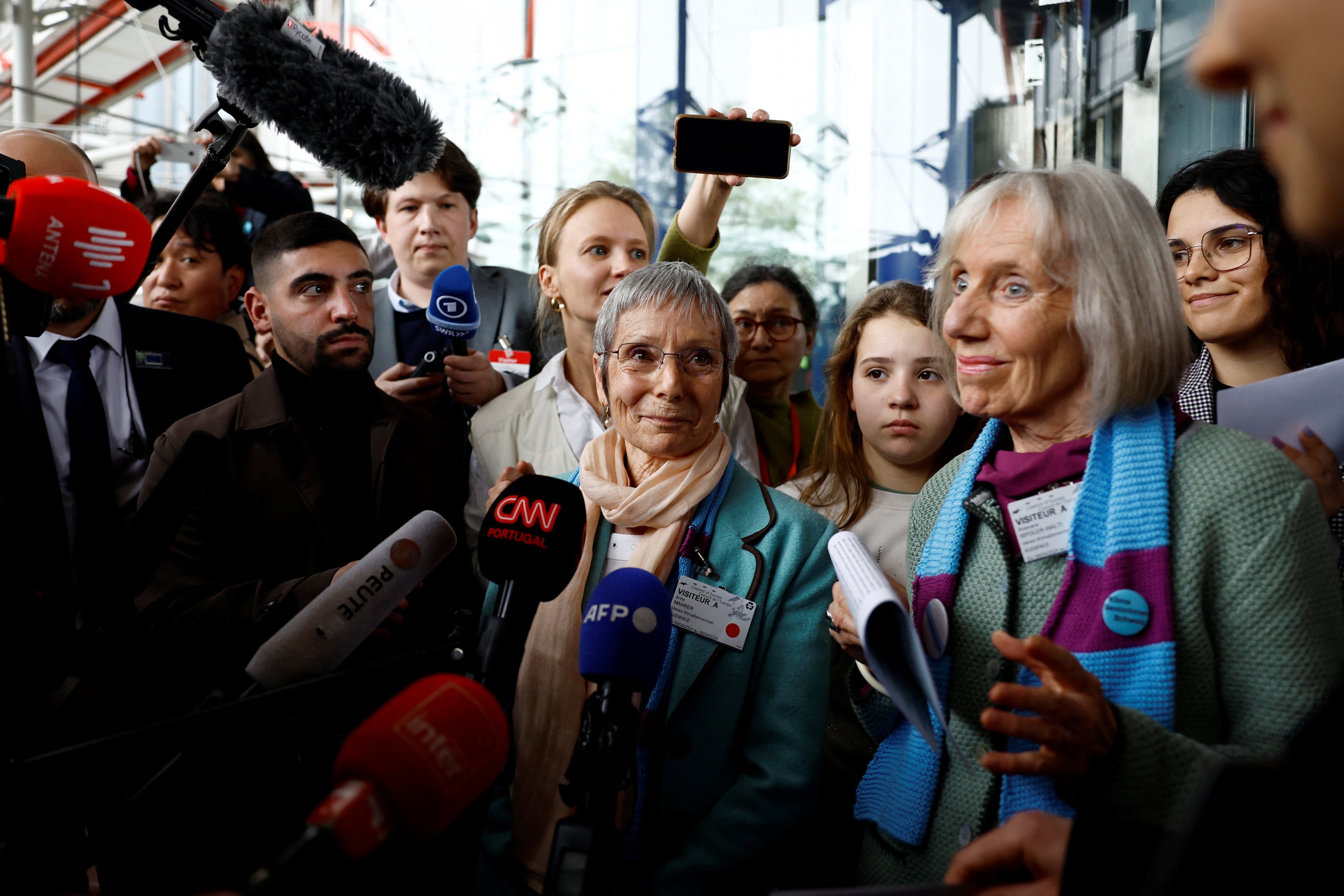 Anne Mahrer and Rosmarie Wyder-Walti, of the Senior Women for Climate Protection, talk to journalists after the court verdict on April 9. Photo: Reuters