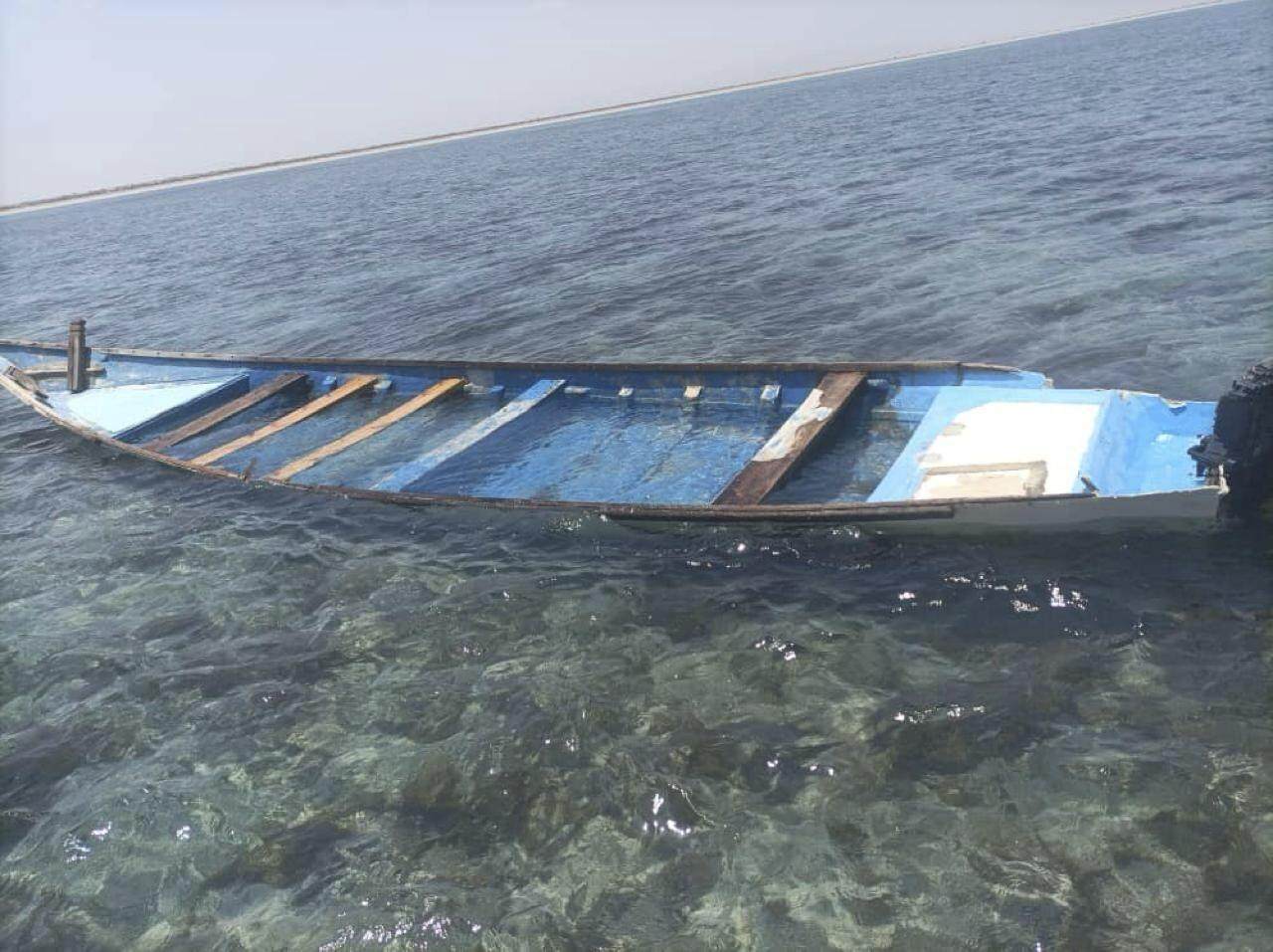 A capsized boat is seen near the coastal town of Obock, in northeastern Djibouti on Tuesday. Photo: International Organization for Migration via AP