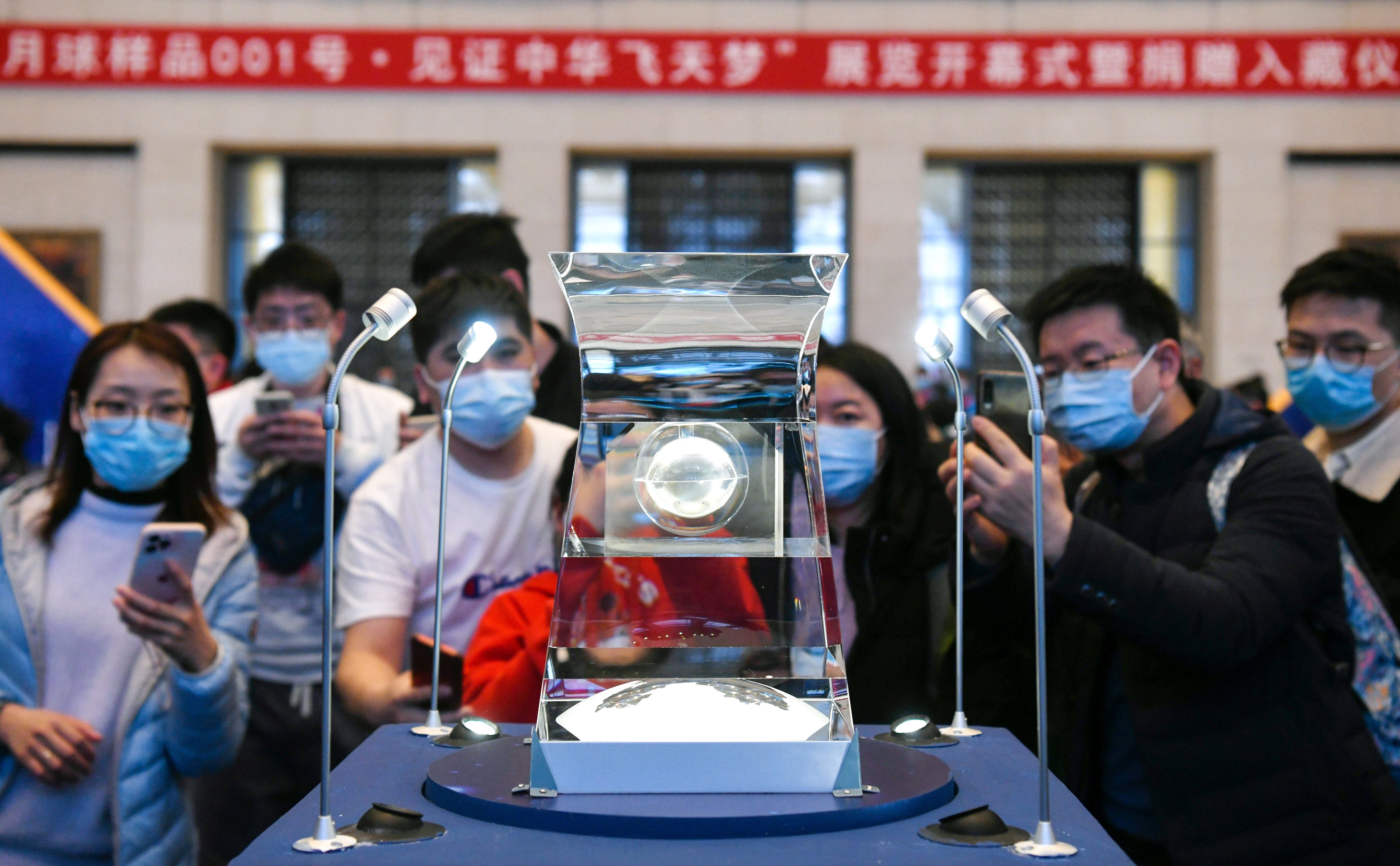 People view lunar samples brought back by China’s Chang’e 5 probe at the National Museum of China in Beijing in 2021. Some of those samples will be loaned to scientists from other countries. Photo: Xinhua 