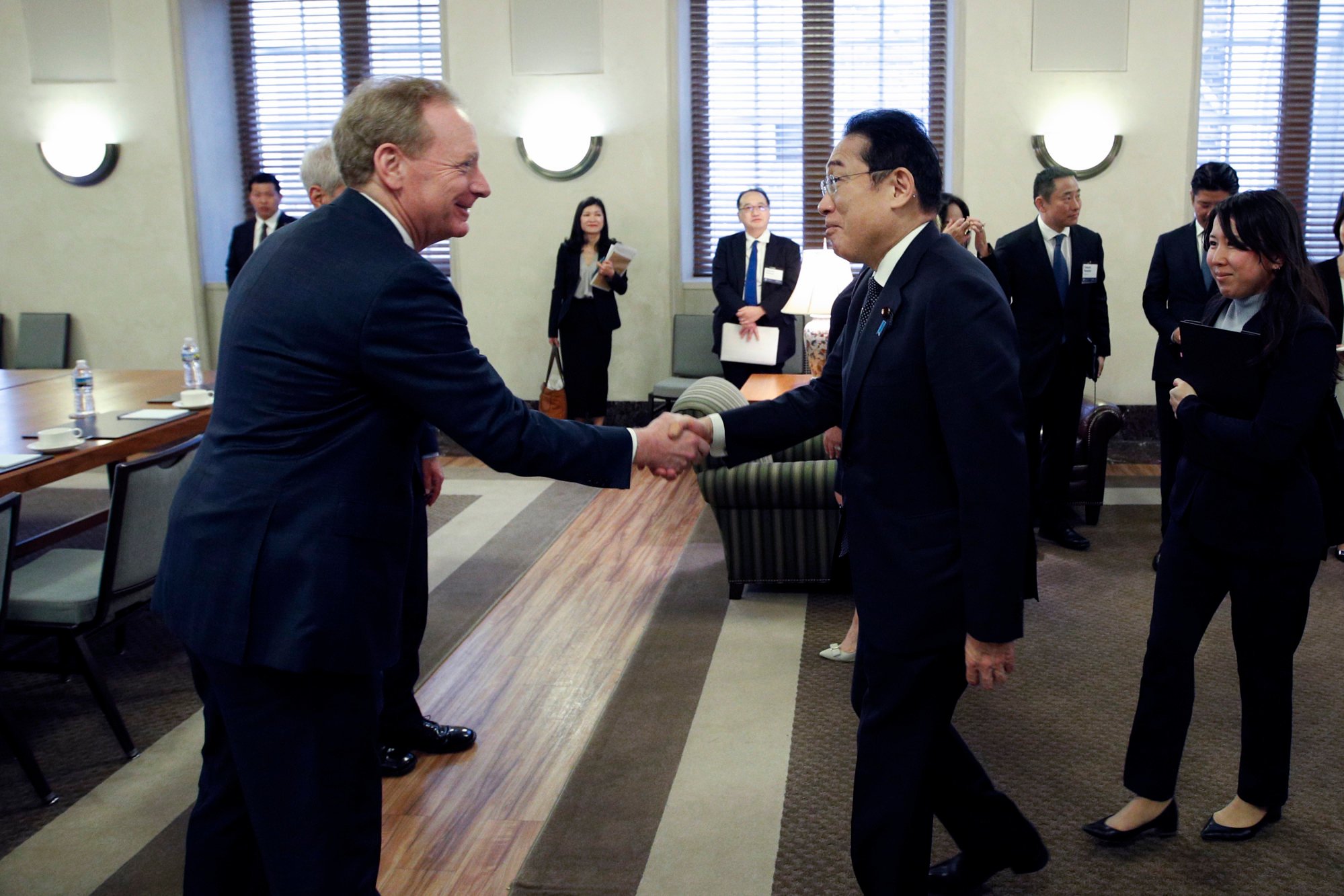 Japanese Prime Minister Fumio Kishida (right) meets Microsoft vice-chair and president Brad Smith during the US-Japan business conference on Tuesday in Washington. Photo: AP