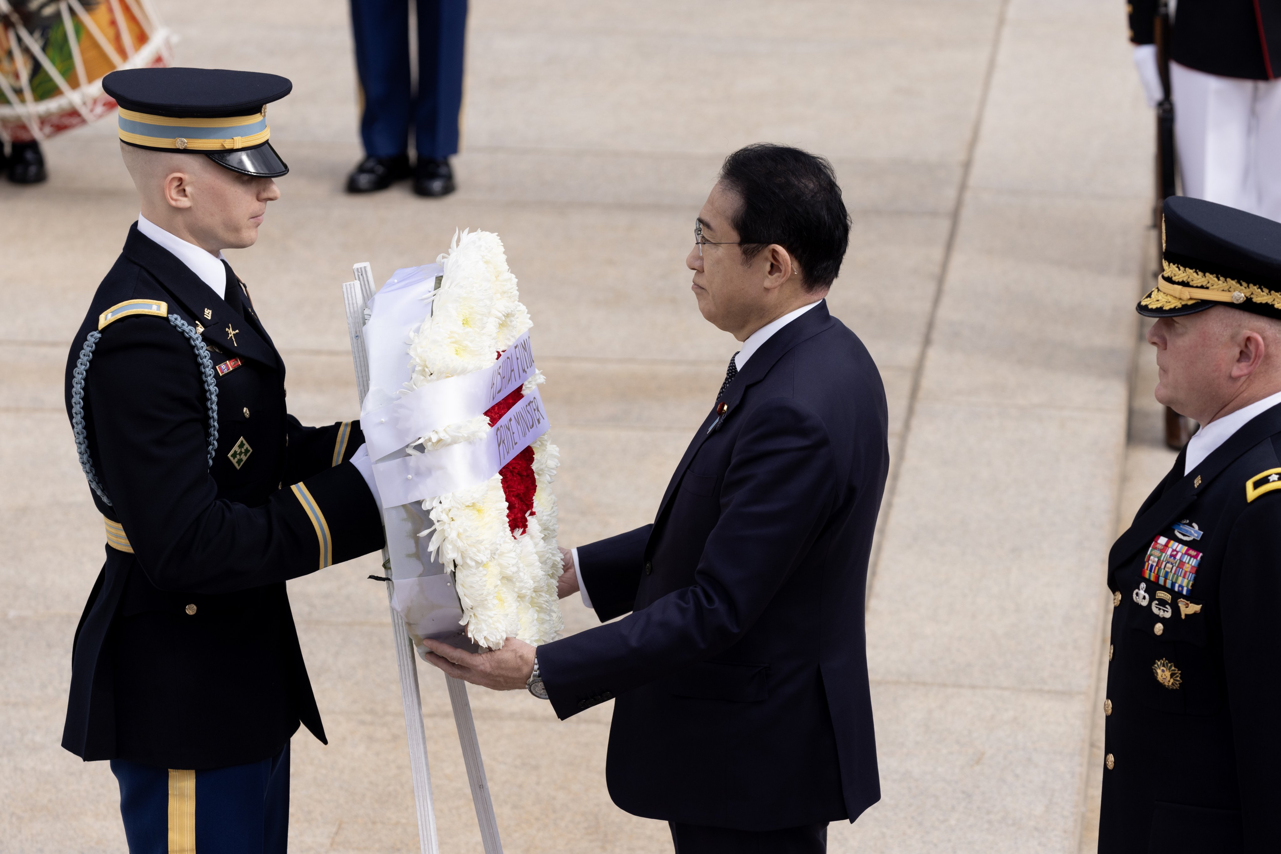 Japanese Prime Minister Fumio Kishida (centre) takes part in a US Armed Forces full-honor wreath ceremony at the Tomb of the Unknown Soldier at Arlington National Cemetery in Virginia on Tuesday. Photo: EPA-EFE