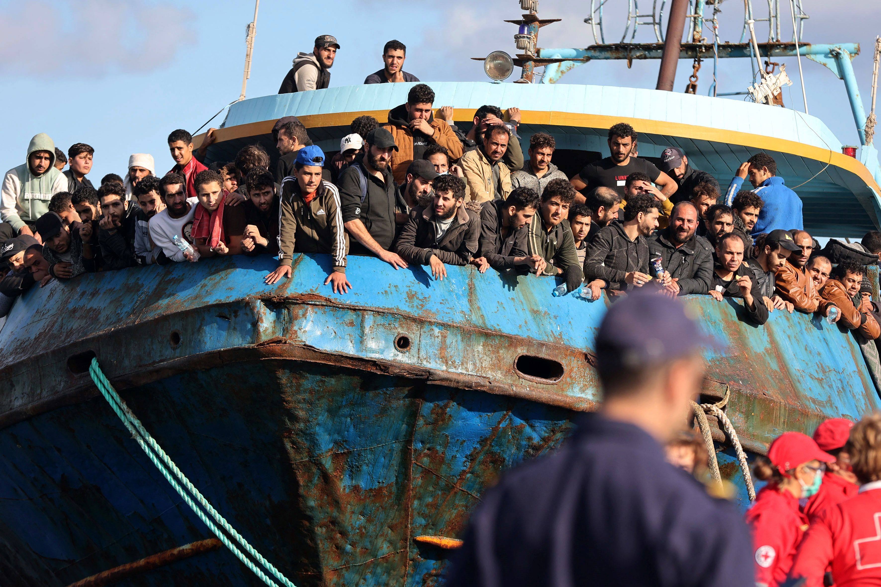 Rescued refugees and migrants stand on a boat at the town of Paleochora, southwestern Crete, in November 2022. Photo: AFP