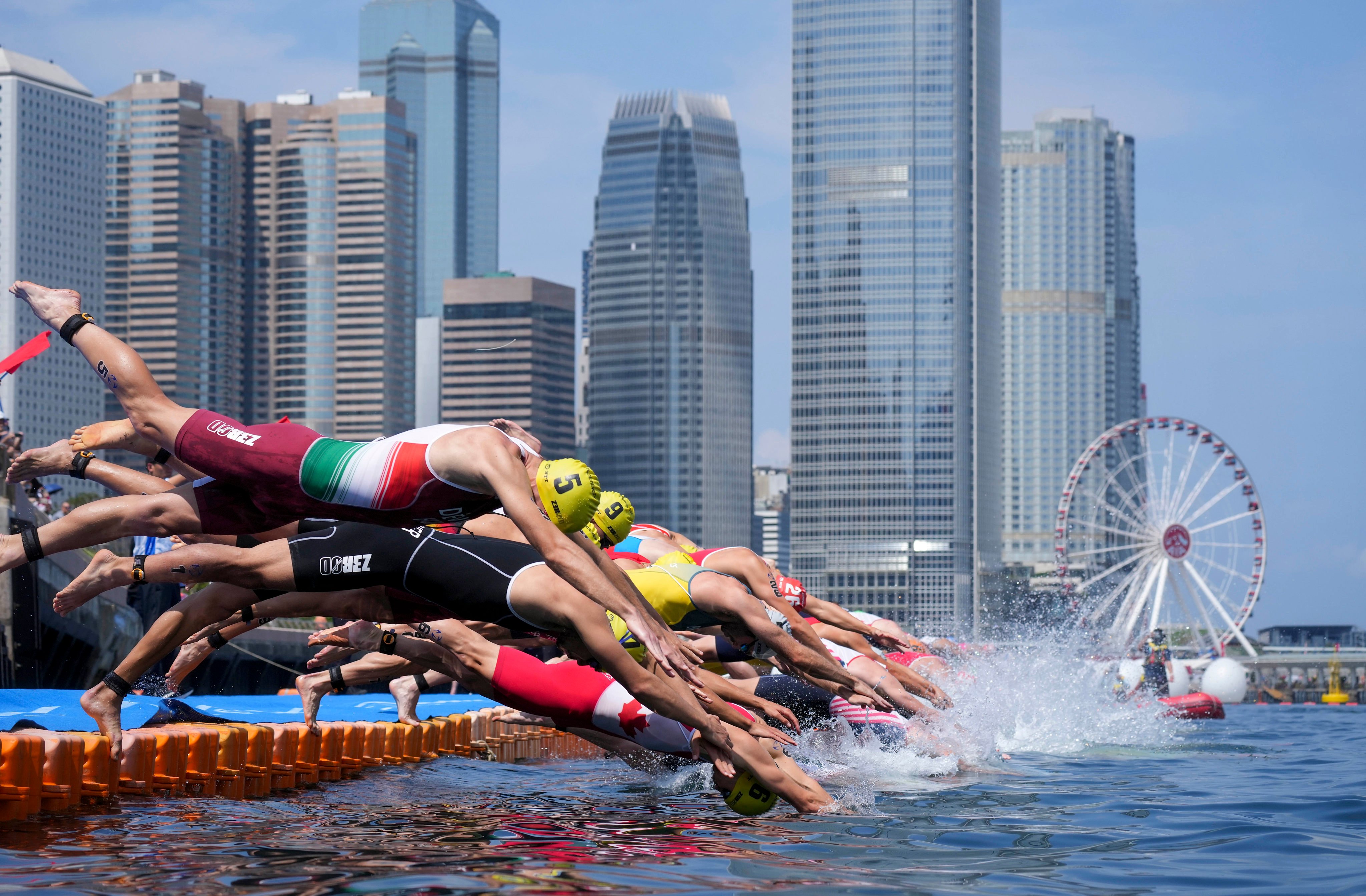 Competitors take the plunge at the Triathlon World Cup held in Hong Kong last month. The National Games event will also be held at Victoria Harbour. Photo: Elson Li
