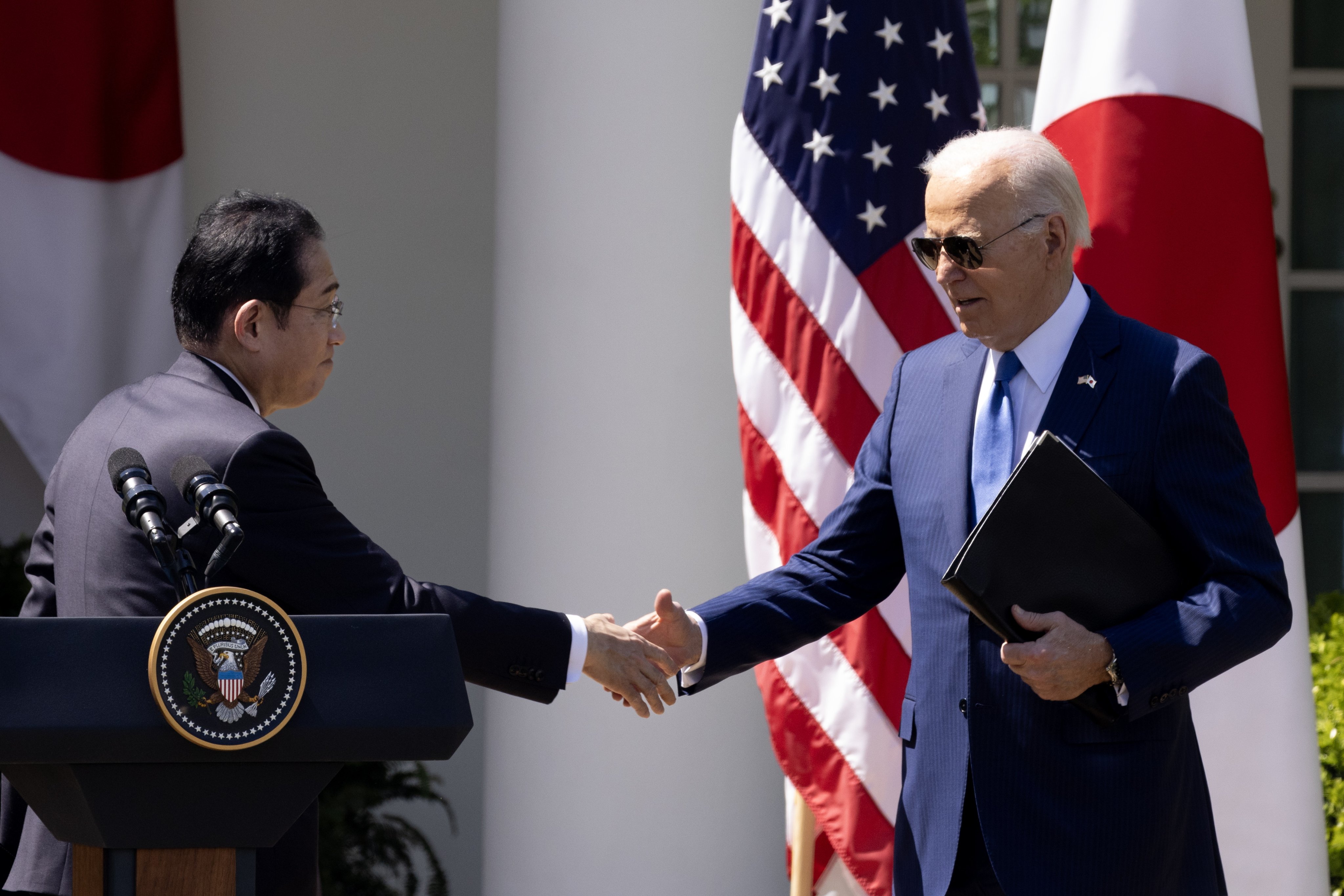 Japanese Prime Minister Fumio Kishida (left) and US President Joe Biden shake hands at the conclusion of their joint news conference in the White House Rose Garden in Washington on Wednesday. Photo: EPA-EFE
