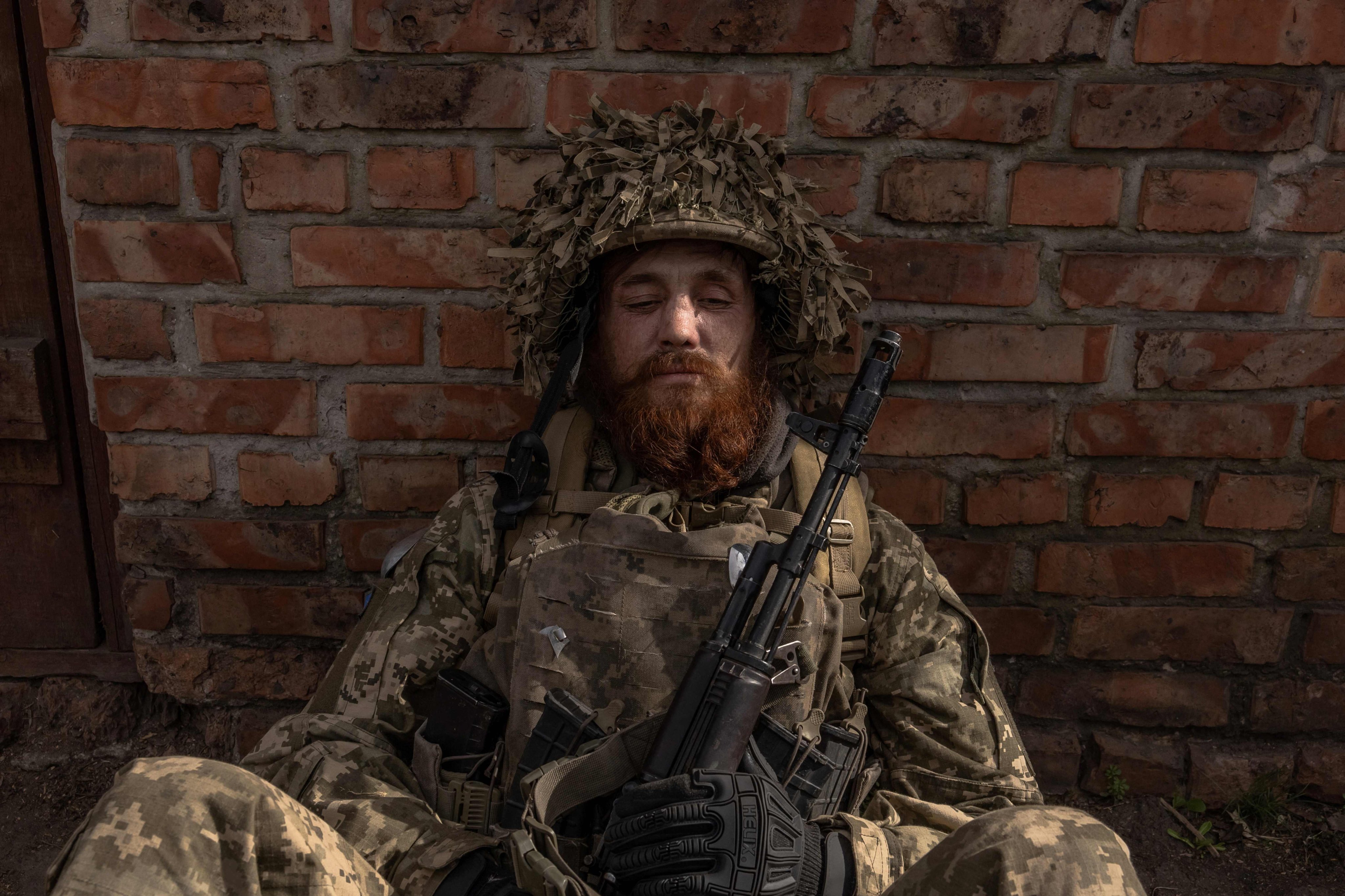 A Ukrainian soldier waits to head toward the front line in the Avdiivka direction, in the Donetsk region. Photo: AFP