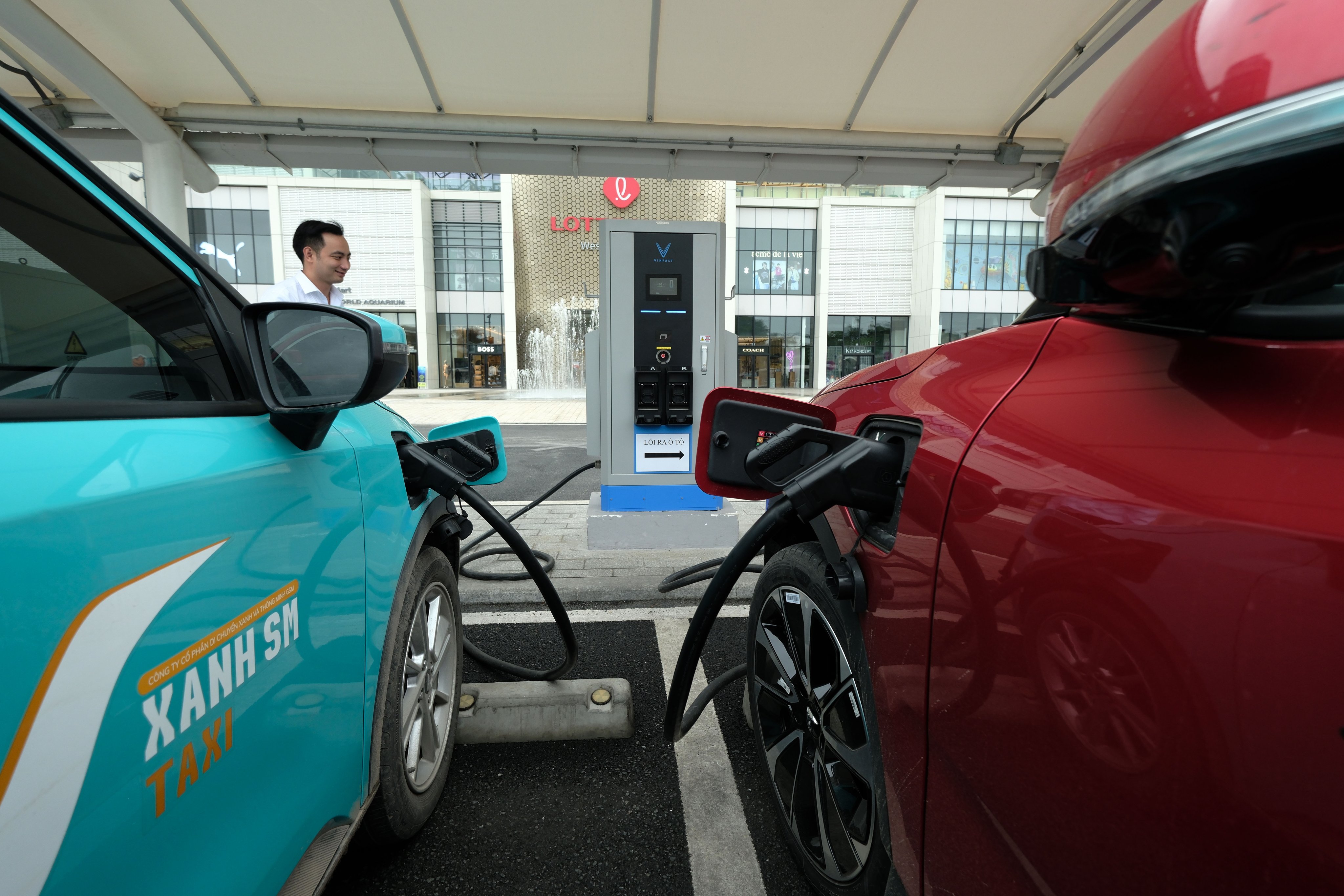 Cars recharge at an electric vehicle charging station in Hanoi on April 8. Asia must develop a skilled labour force capable of supporting its energy transition. Photo: EPA-EFE