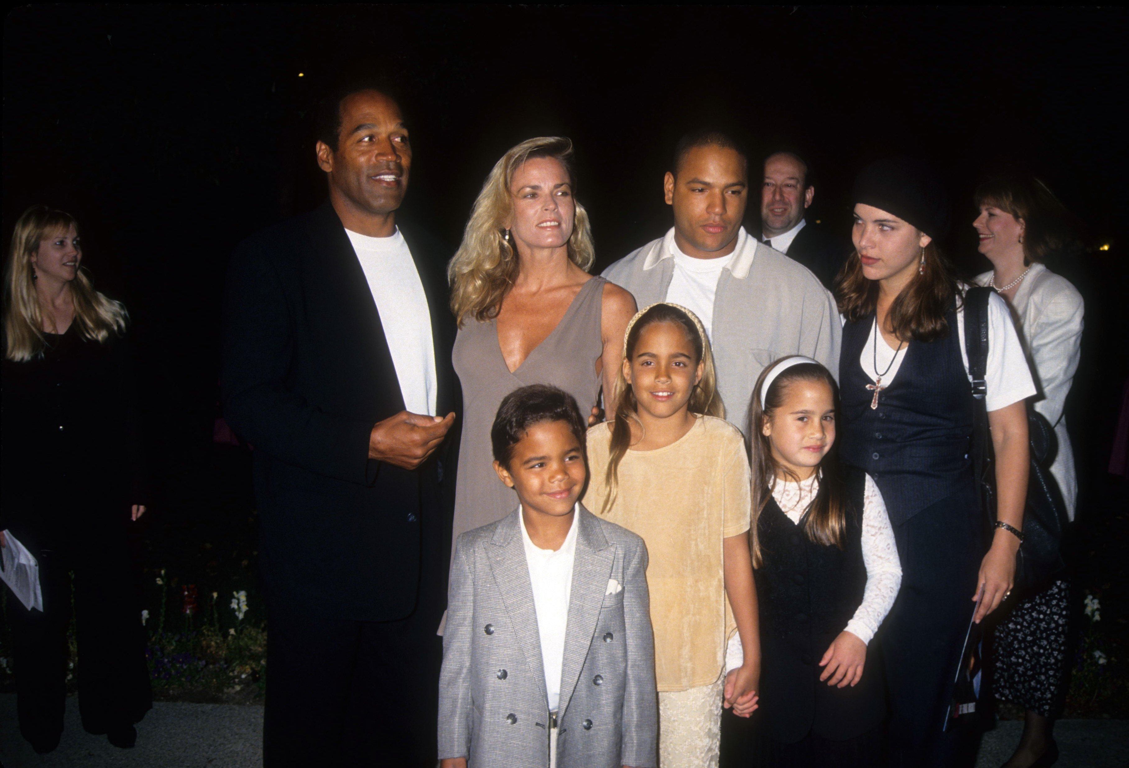 OJ Simpson, Nicole Brown Simpson, Jason Simpson, Sydney Brooke Simpson and Justin Ryan Simpson pose at the premiere of the Naked Gun 33 1/3: The Final Insult in which OJ starred in 1994, in Los Angeles, California. Photo: Getty Images