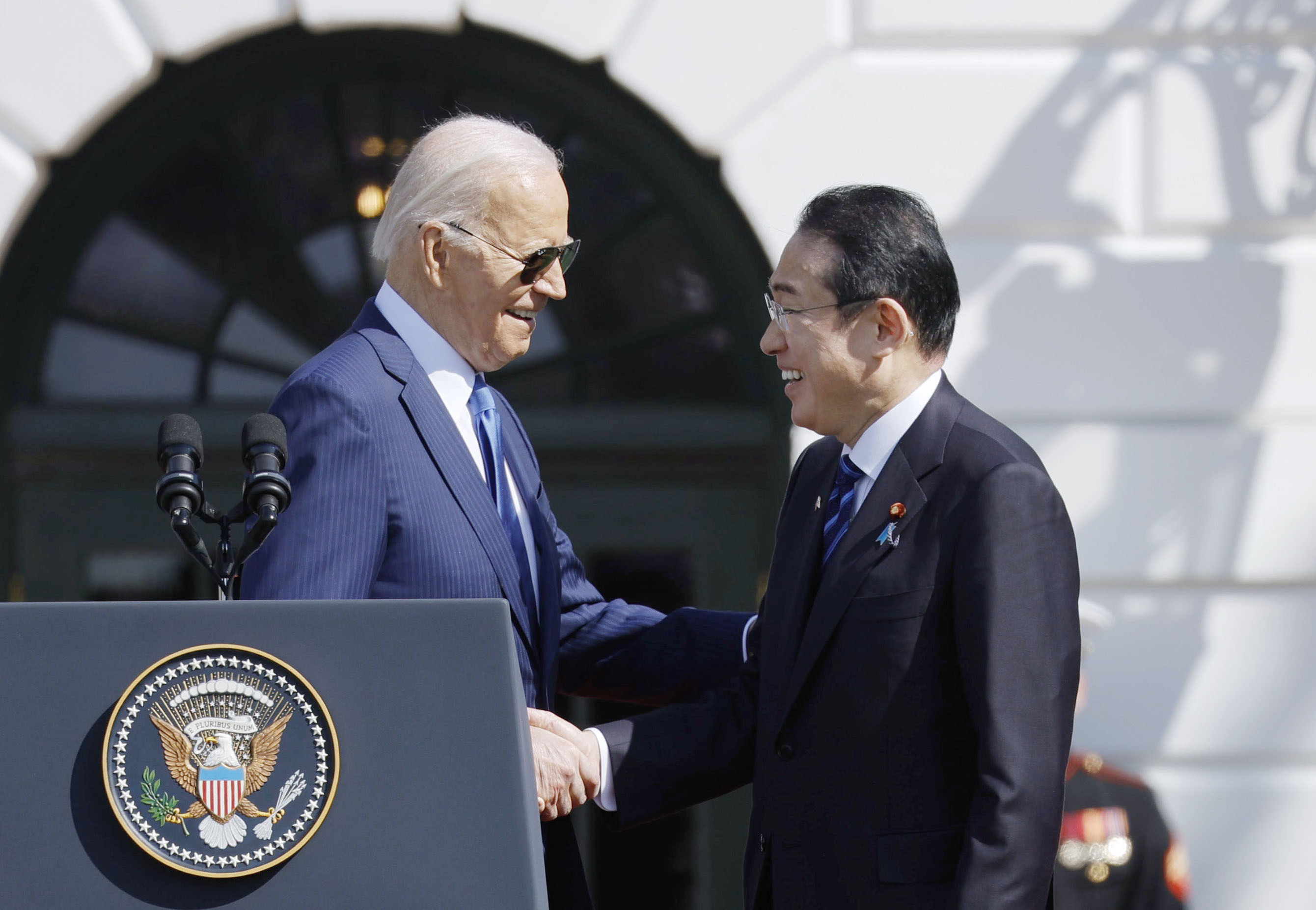 Japanese Prime Minister Fumio Kishida (right) and US President Joe Biden shake hands at the White House on Wednesday ahead of their summit. Photo: Kyodo