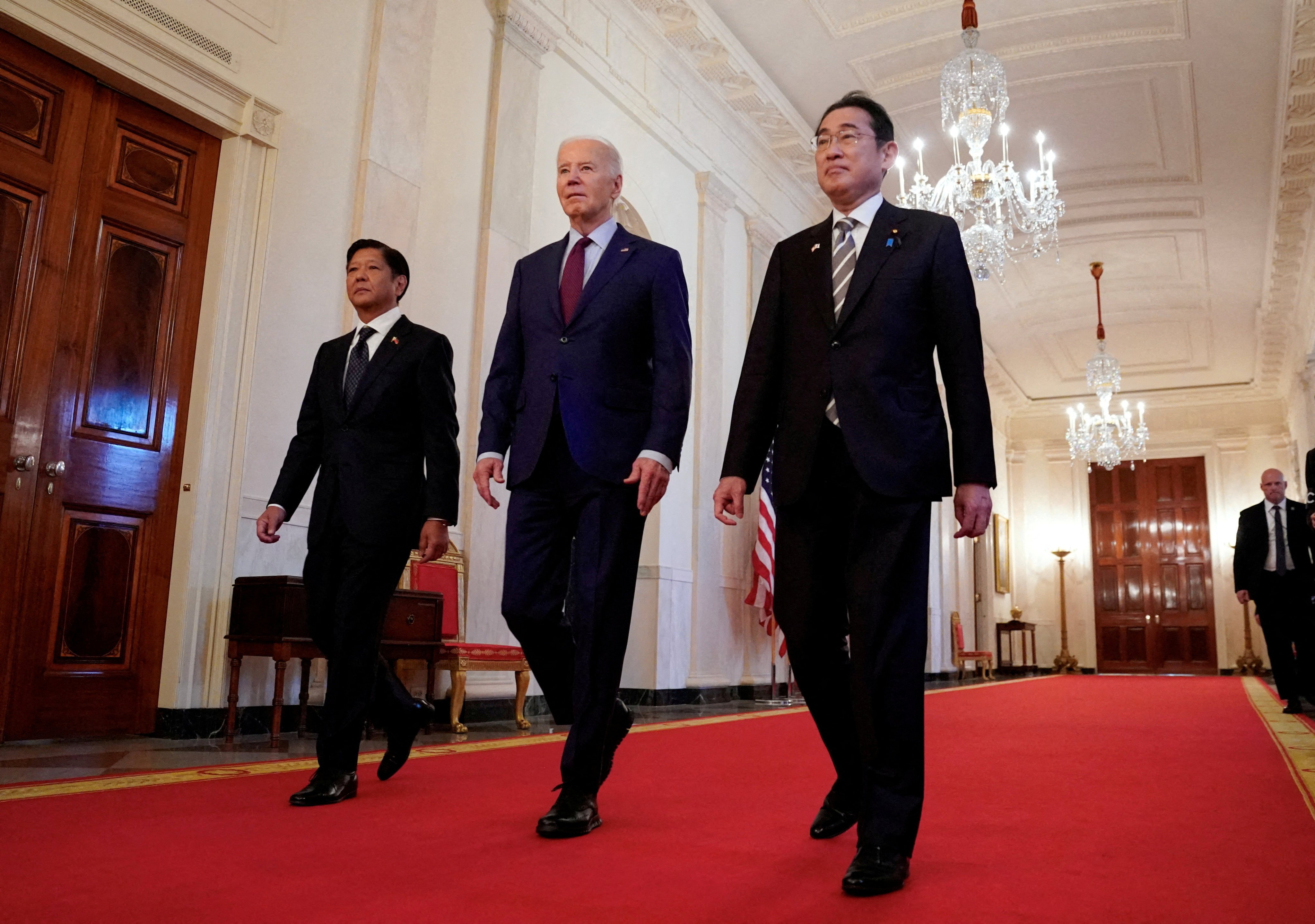 US President Joe Biden escorts Philippine President Ferdinand Marcos Jnr and Japanese Prime Minister Fumio Kishida to their trilateral summit at the White House in Washington, on April 11. Though a Southeast Asian survey found that more would align with China over the US, the region’s distrust of Beijing also ticked higher, amid South China Sea tensions. Photo: Reuters