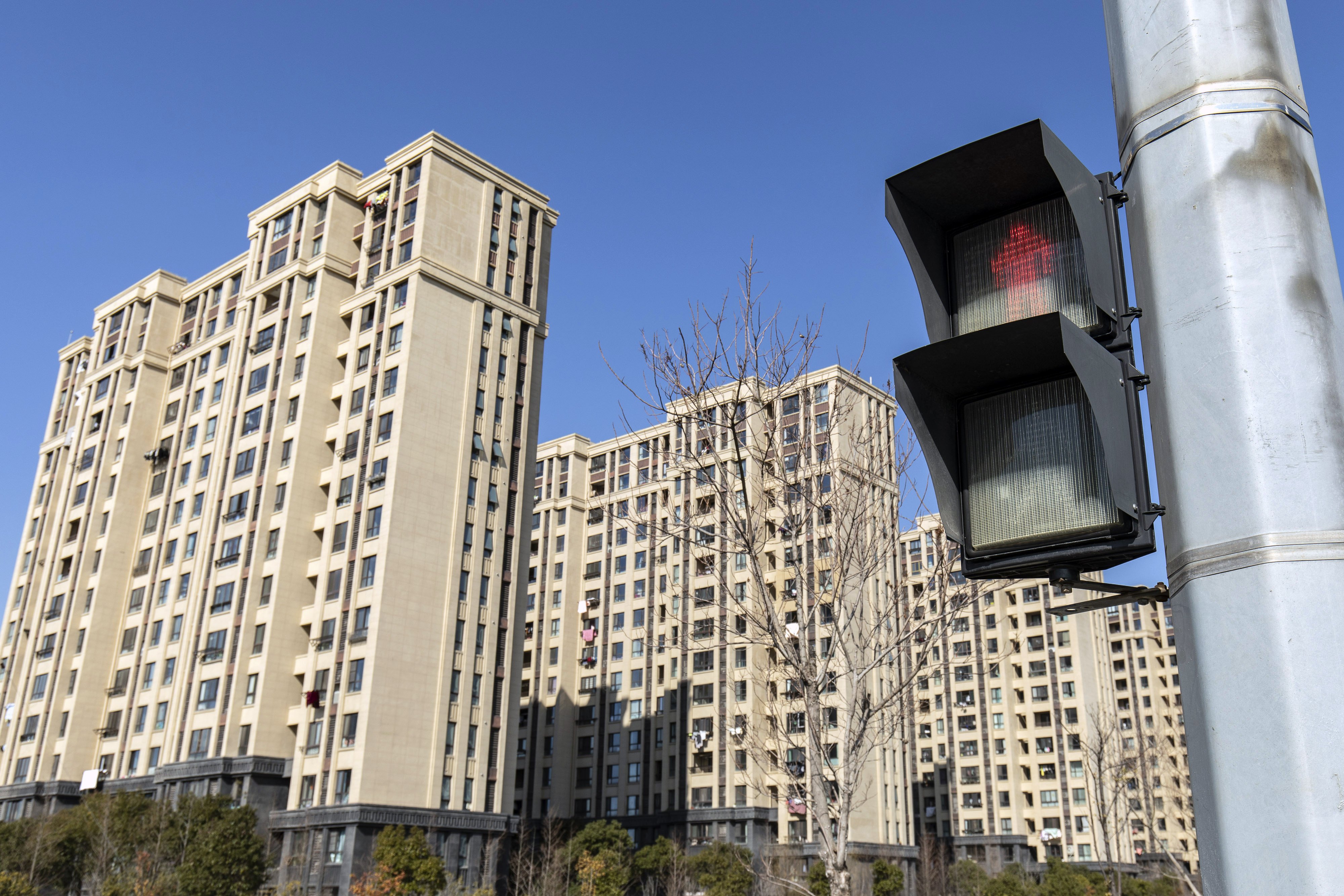 Residential buildings stand in a Zhenro Properties Group development in the Jinshan district of Shanghai on February 24, 2022. Photo: Bloomberg