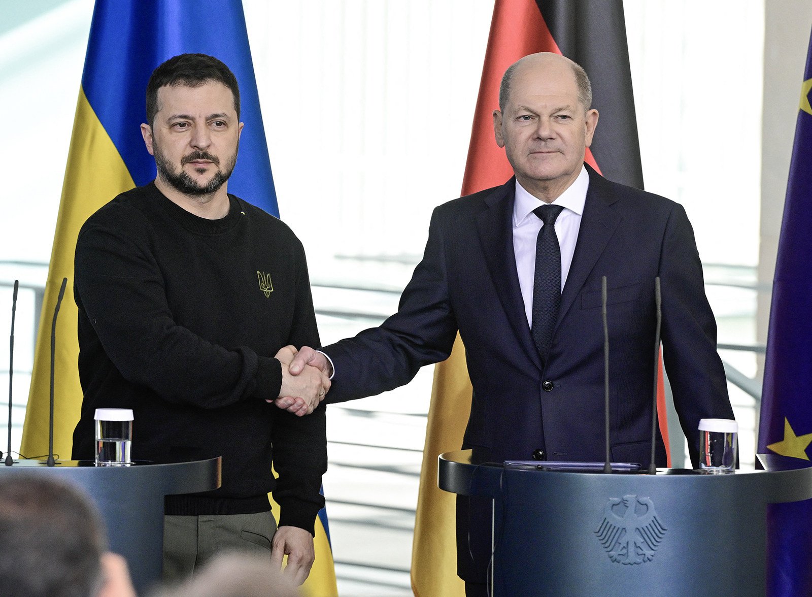 German Chancellor Olaf Scholz (right) and Ukraine’s President Volodymyr Zelensky shake hands after a press conference in Berlin in February. Berlin said on Saturday that it will give Kyiv more weapons to help in its fight against Moscow. Photo: AFP