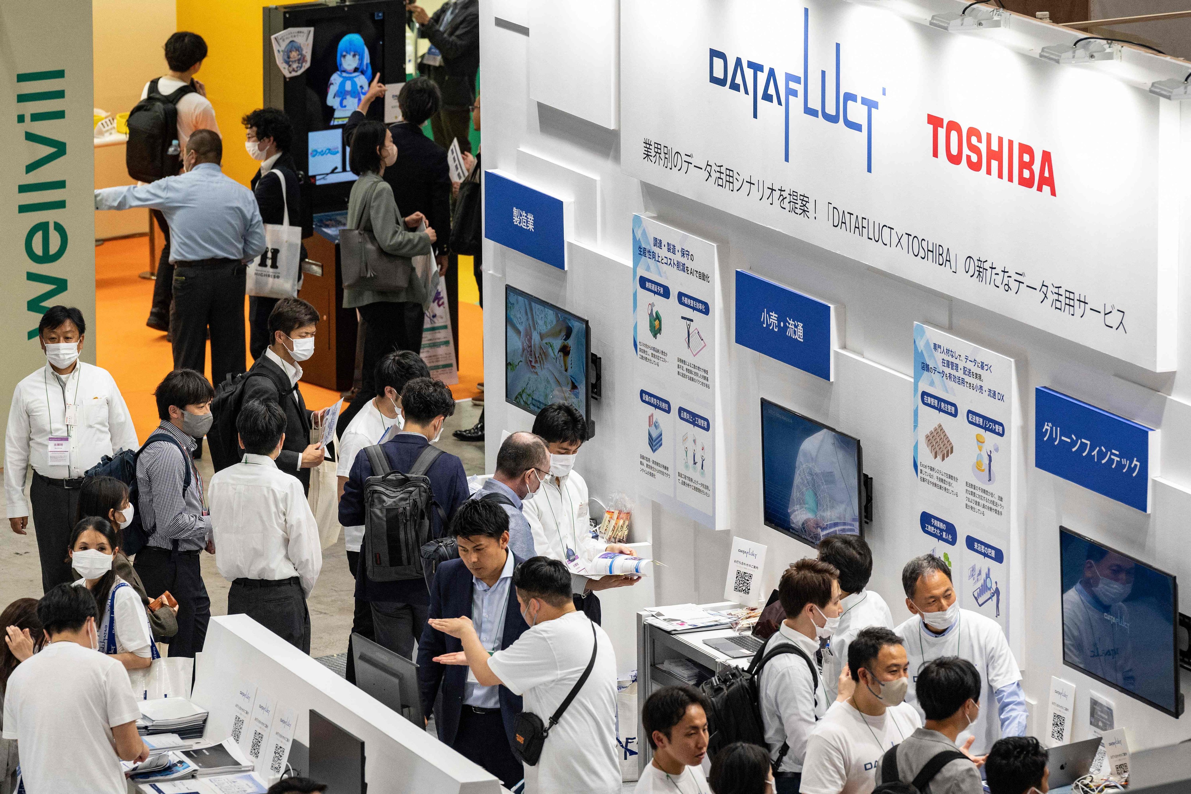 Visitors at the 7th AI Expo, part of NexTech Week Tokyo 2023, Japan’s largest trade show for AI technology companies. US tech giants are pumping billions of dollars into artificial intelligence, cybersecurity and chip production in Japan, which dominated the hardware industry in the 1980s. Photo: AFP