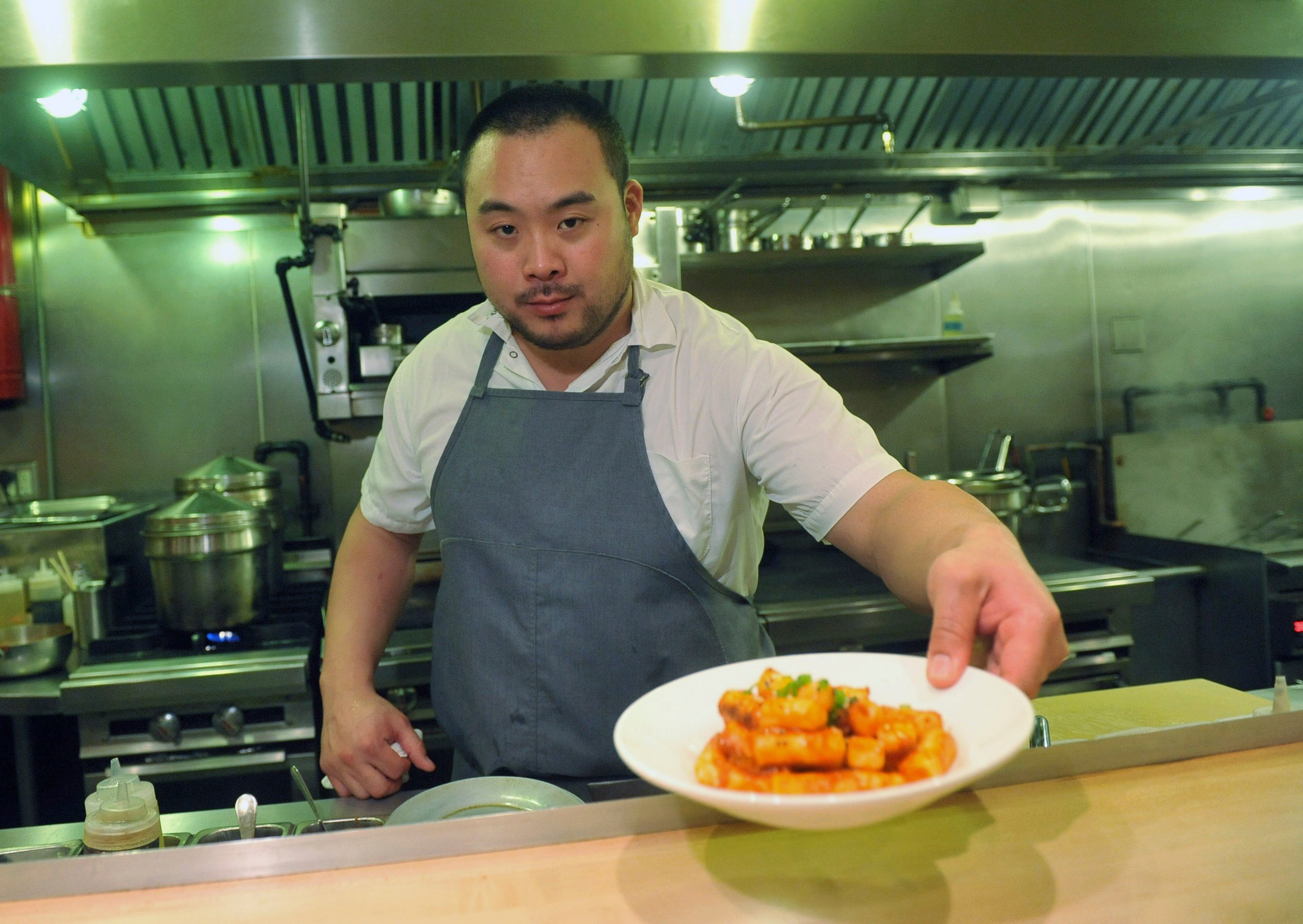 Celebrity chef David Chang presents a dish at Momofuku Noodle Bar in New York in November 2011. Photo: AP