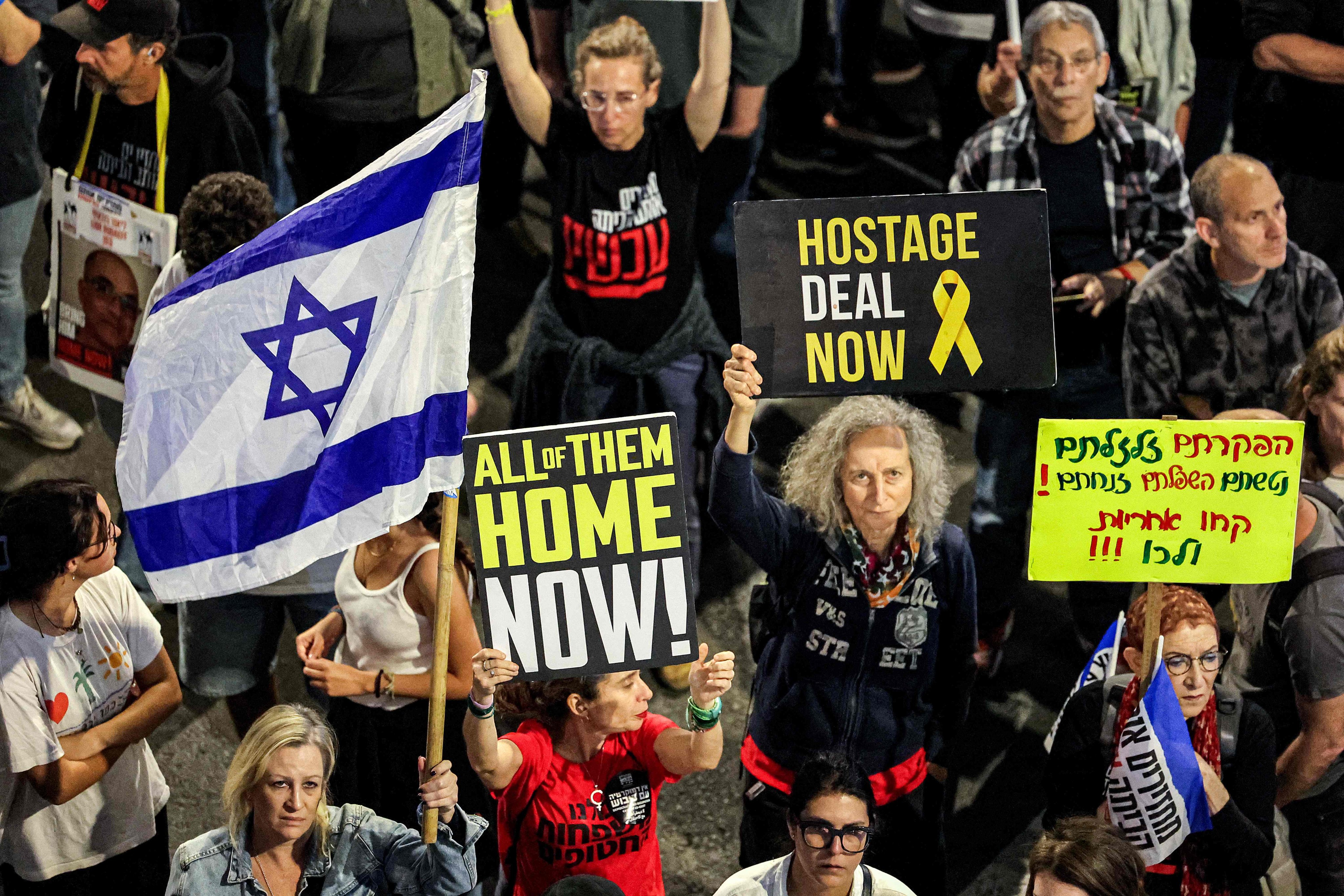 People gather during an anti-government demonstration in Tel Aviv on April 13 to demand action to return the hostages held captive by Palestinian militants in the Gaza Strip since the October 7 attacks. Photo: AFP