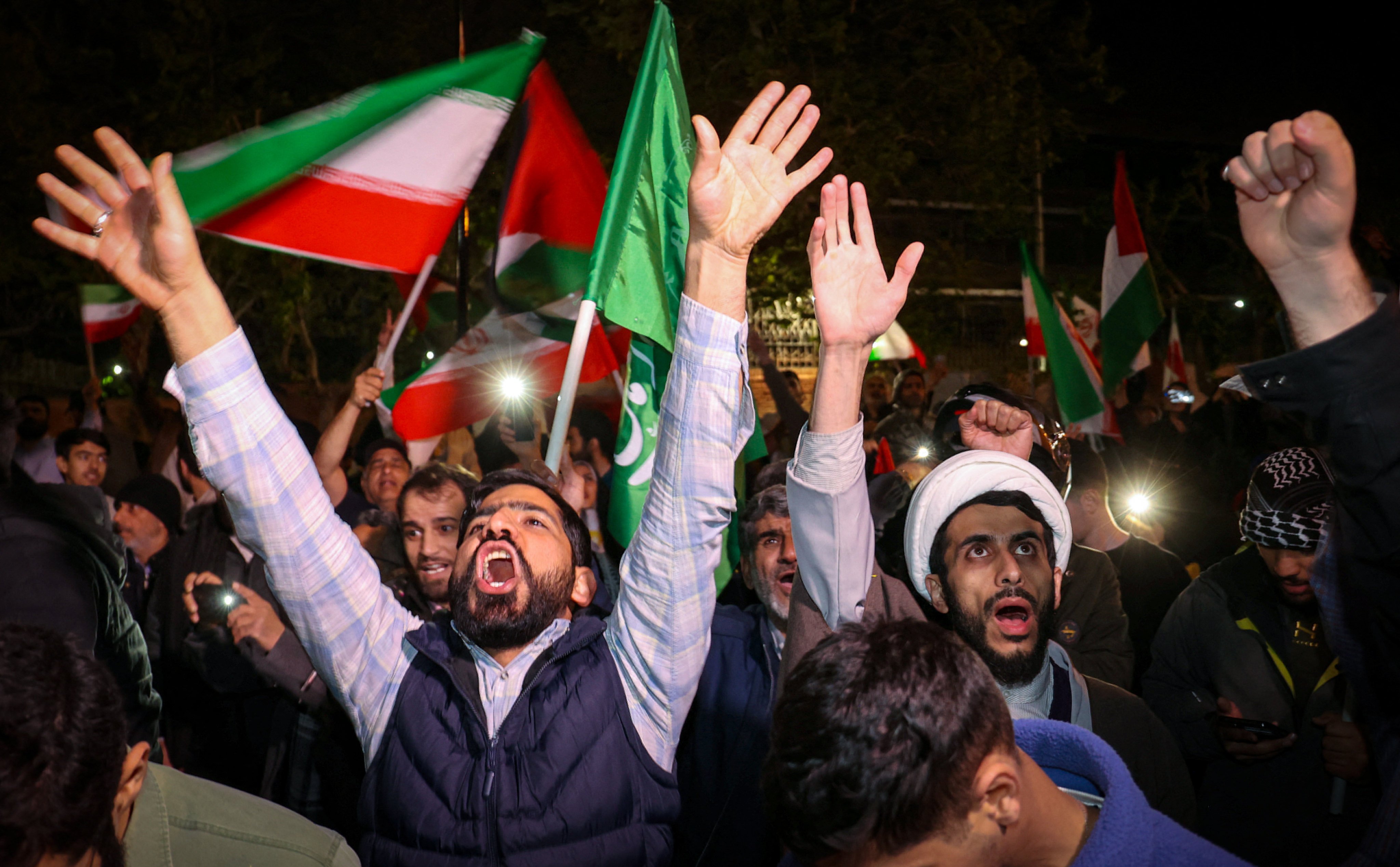Iranian demonstrators react to their military’s attack on Israel at a gathering in front of the British embassy in Tehran, Iran, on Sunday. Photo: via Reuters