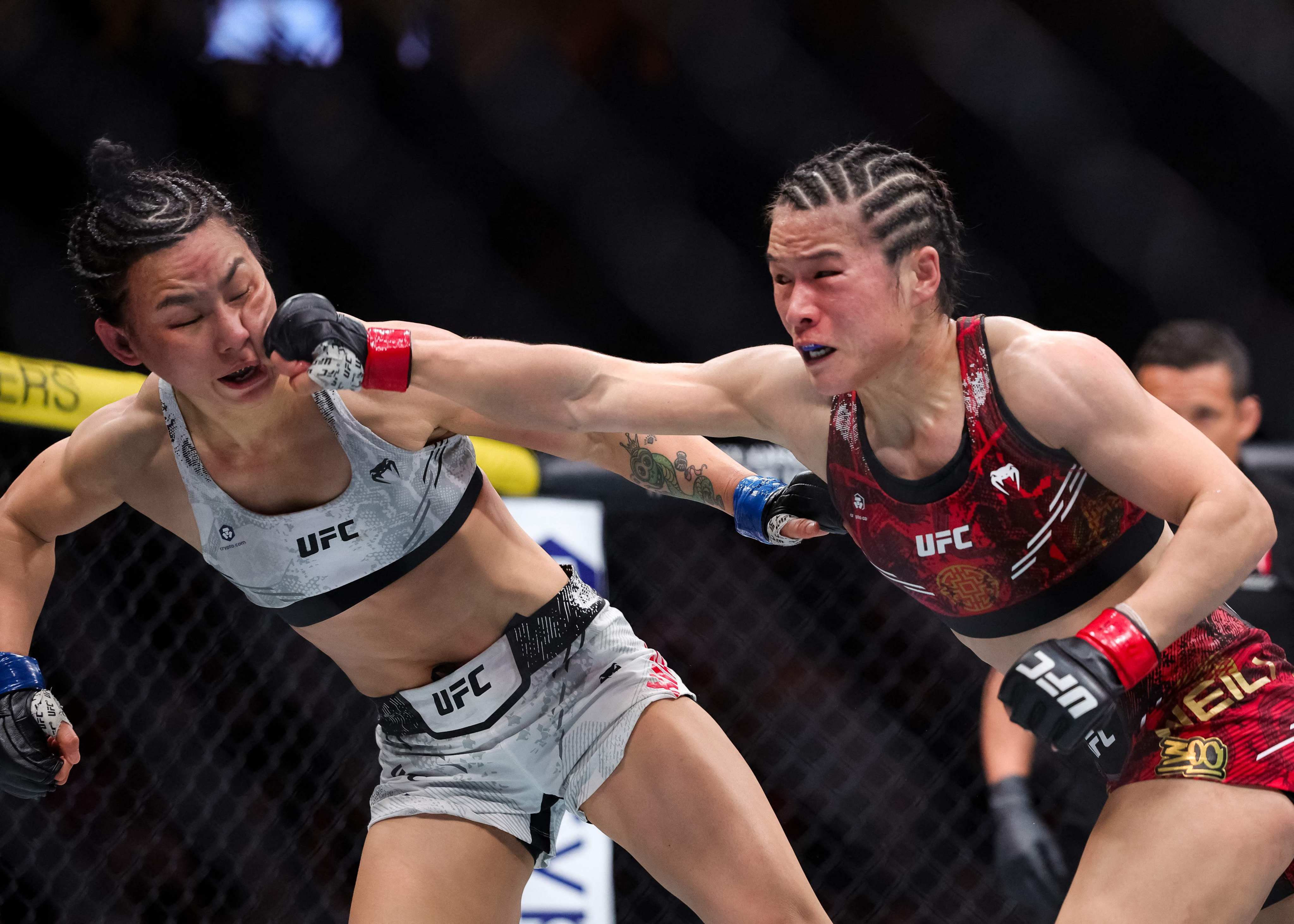 Zhang Weili punches Yan Xiaonan during their strawweight championship fight in Las Vegas. Photo: Getty Images via AFP