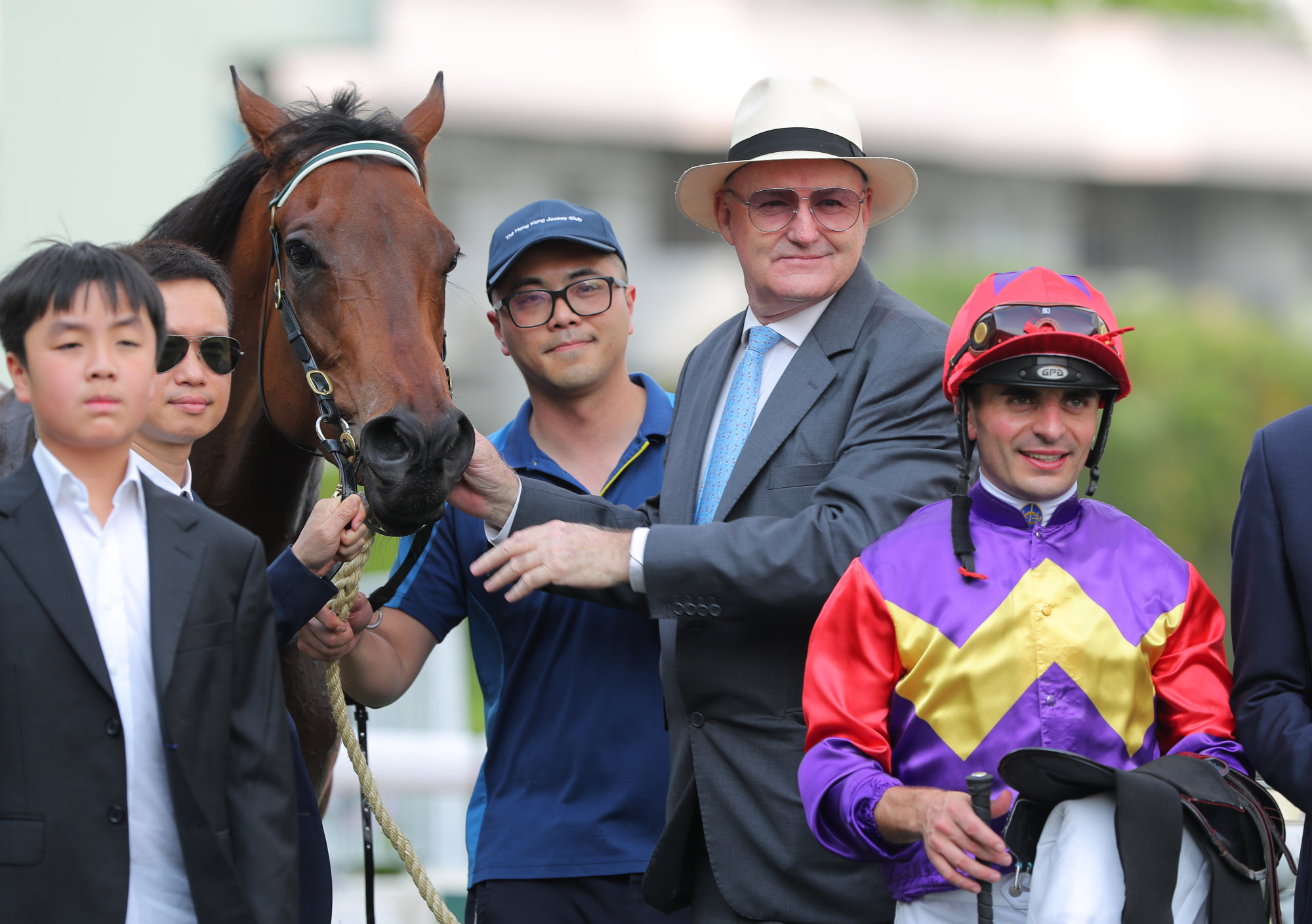 Trainer David Hayes, jockey Andrea Atzeni and connections of Lucky Encounter celebrate his win.