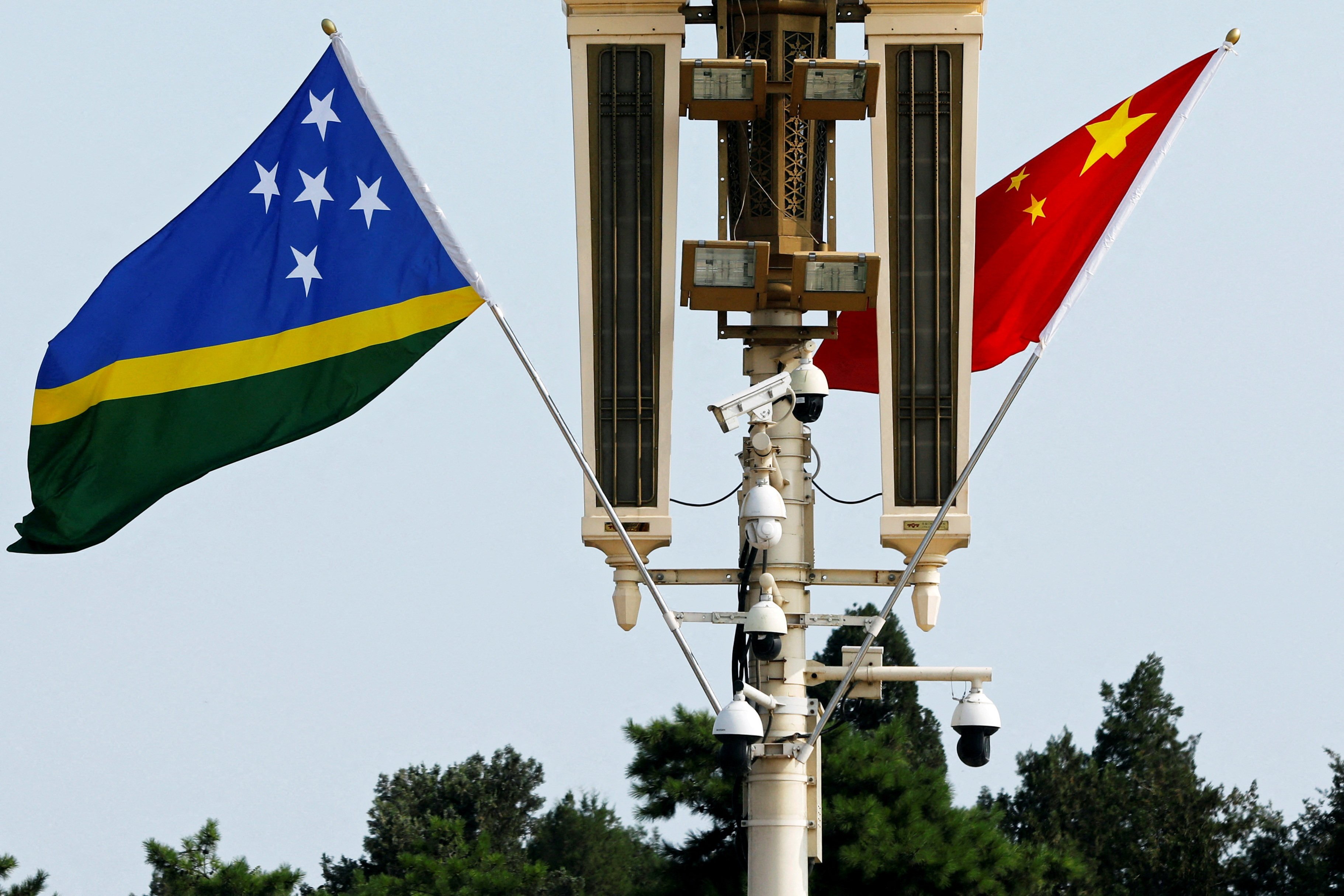 Flags of Solomon Islands and China flutter near Tiananmen square in Beijing, China. Photo: Reuters/File