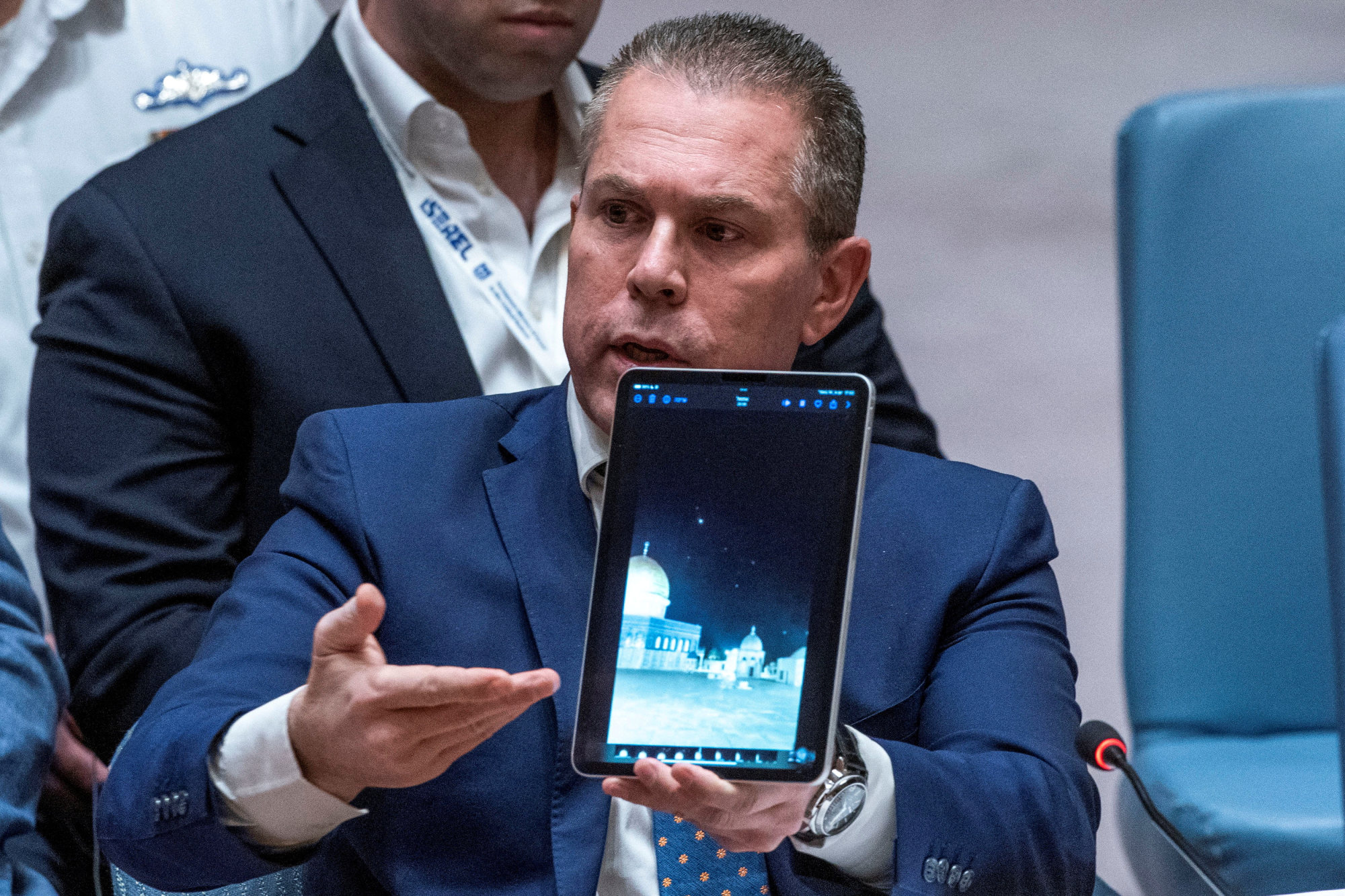 Israel’s ambassador to the United Nations Gilad Erdan shows a video of the attacks. Photo: Reuters