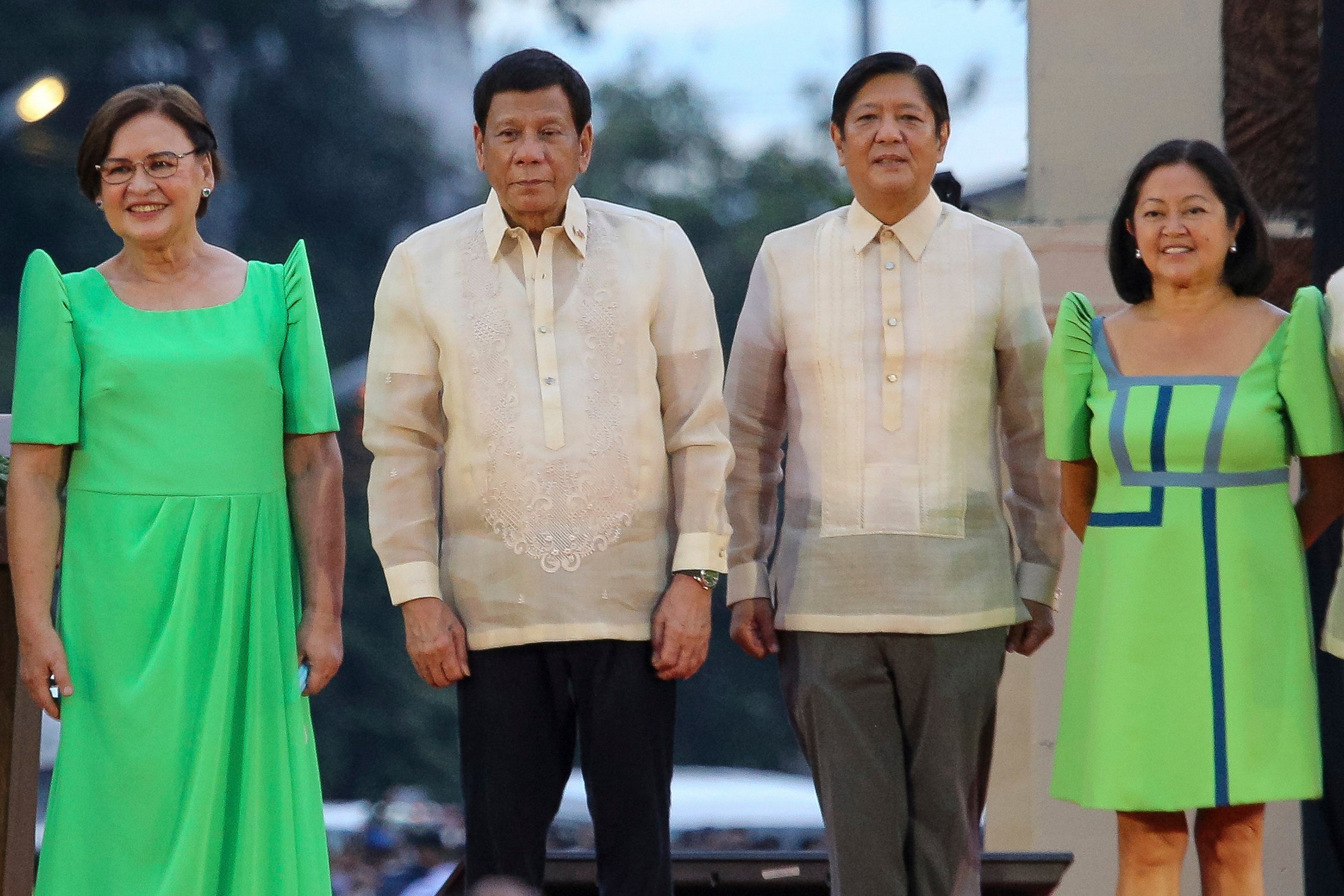 Rodrigo Duterte (second from left) stands besides President Ferdinand Marcos Jnr (second from right) as they attend the oath taking rites of Vice-President elect Sara Duterte in Davao city on June 19, 2022. Photo: AP