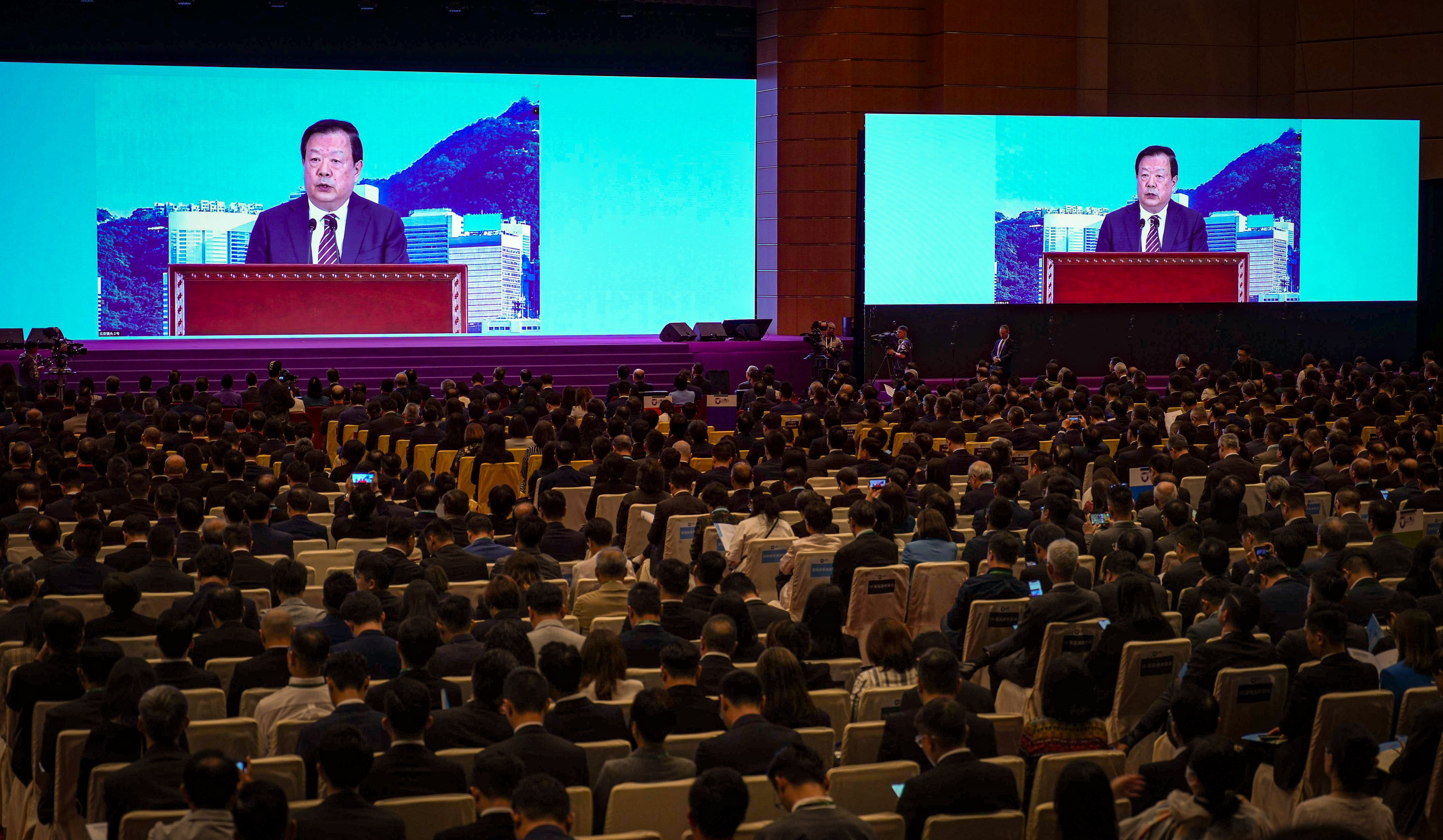 Xia Baolong, the director of the Hong Kong and Macau Affairs Office, delivers a speech by video link for the National Security Education Day opening ceremony. Photo: Eugene Lee