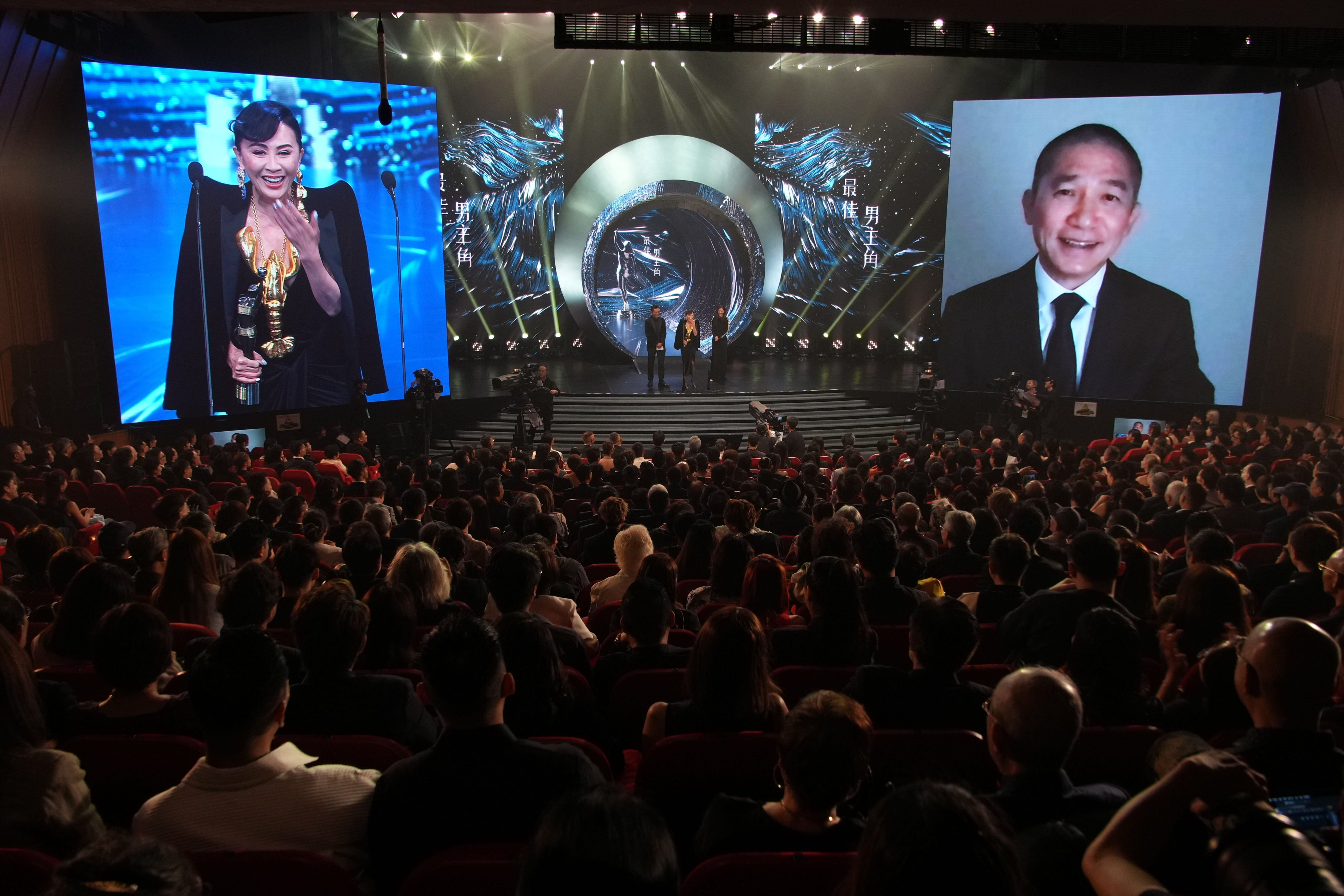 Carina Lau accepts the best actor prize for her husband Tony Leung, who gives a speech via video link. Photo: Eugene Lee