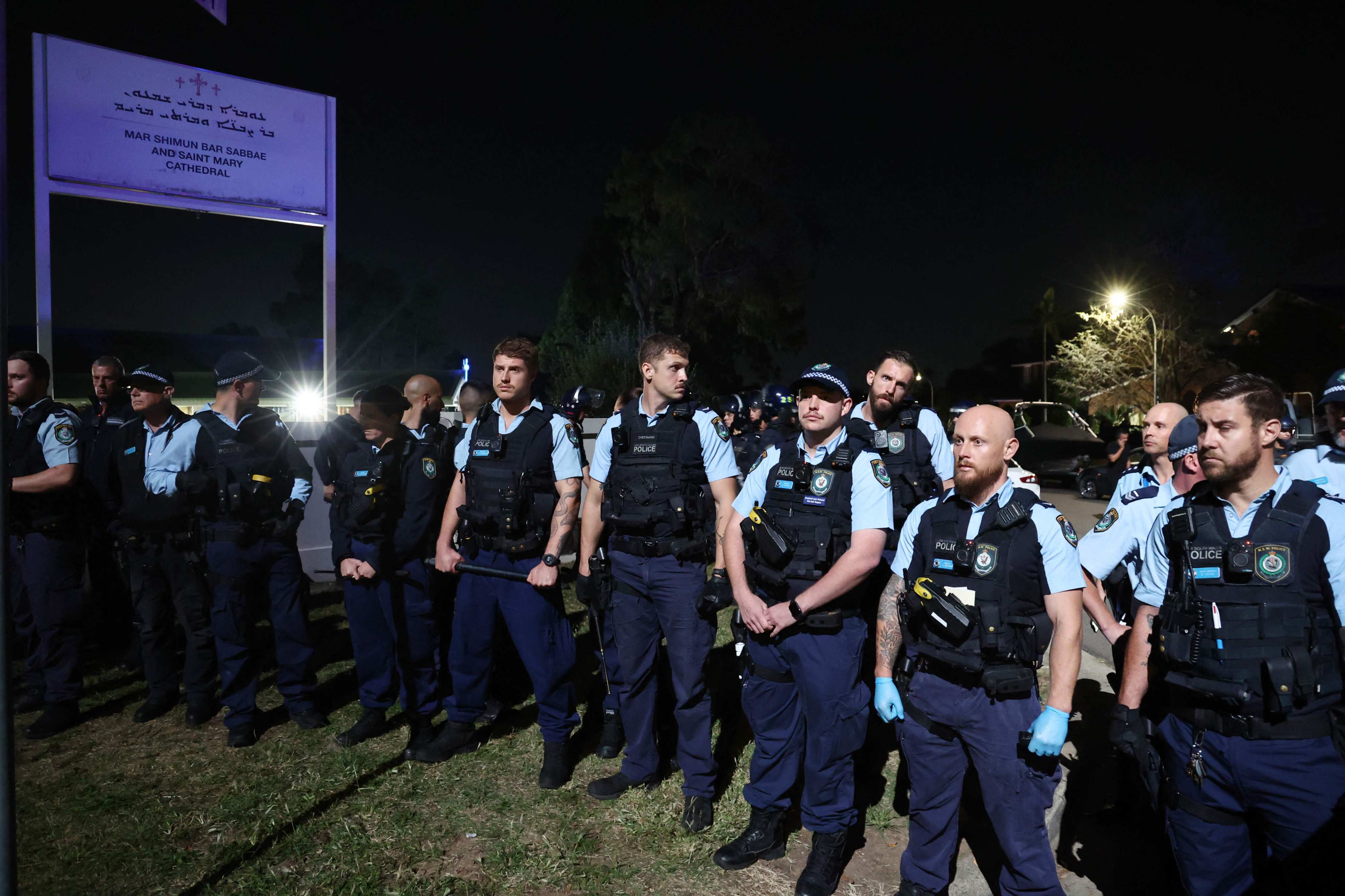 New South Wales police guard the perimeter of the Christ the Good Shepherd Church in Sydney’s western suburb of Wakeley, after several people were stabbed in the church premises. Photo: AFP
