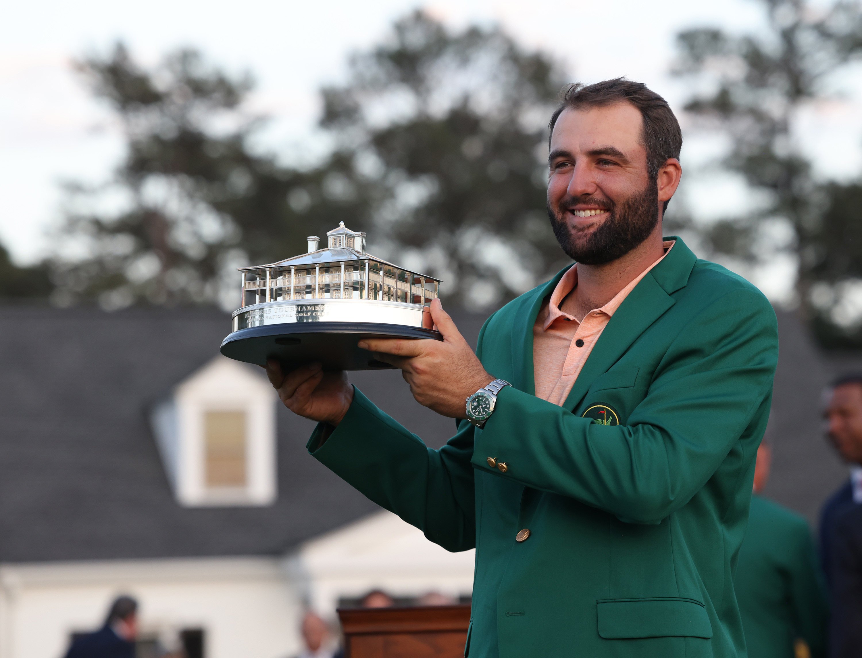 Scottie Scheffler holds the Masters Champion trophy at Augusta National Golf Club. Photo: TNS