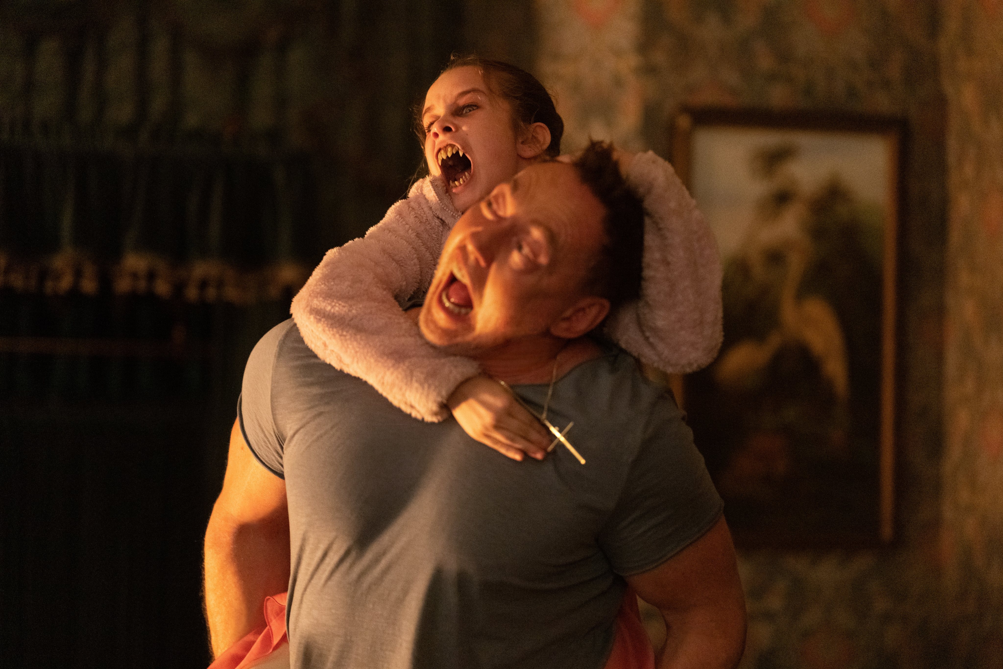 Alisha Weir (top) and Kevin Durand in a still from Abigail.