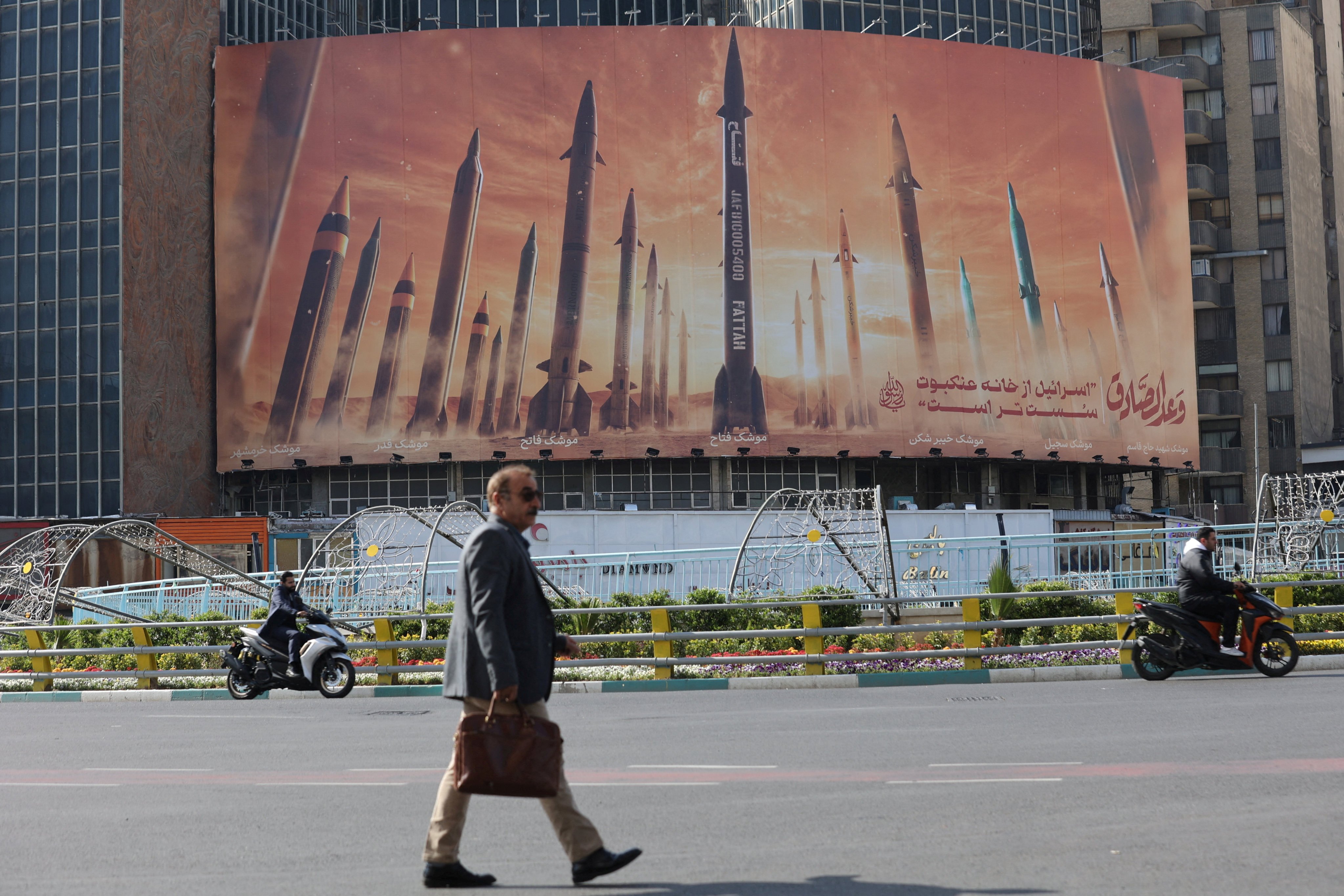 An anti-Israel billboard with featuring Iranian missiles in Tehran, Iran. Photo: WANA via Reuters 