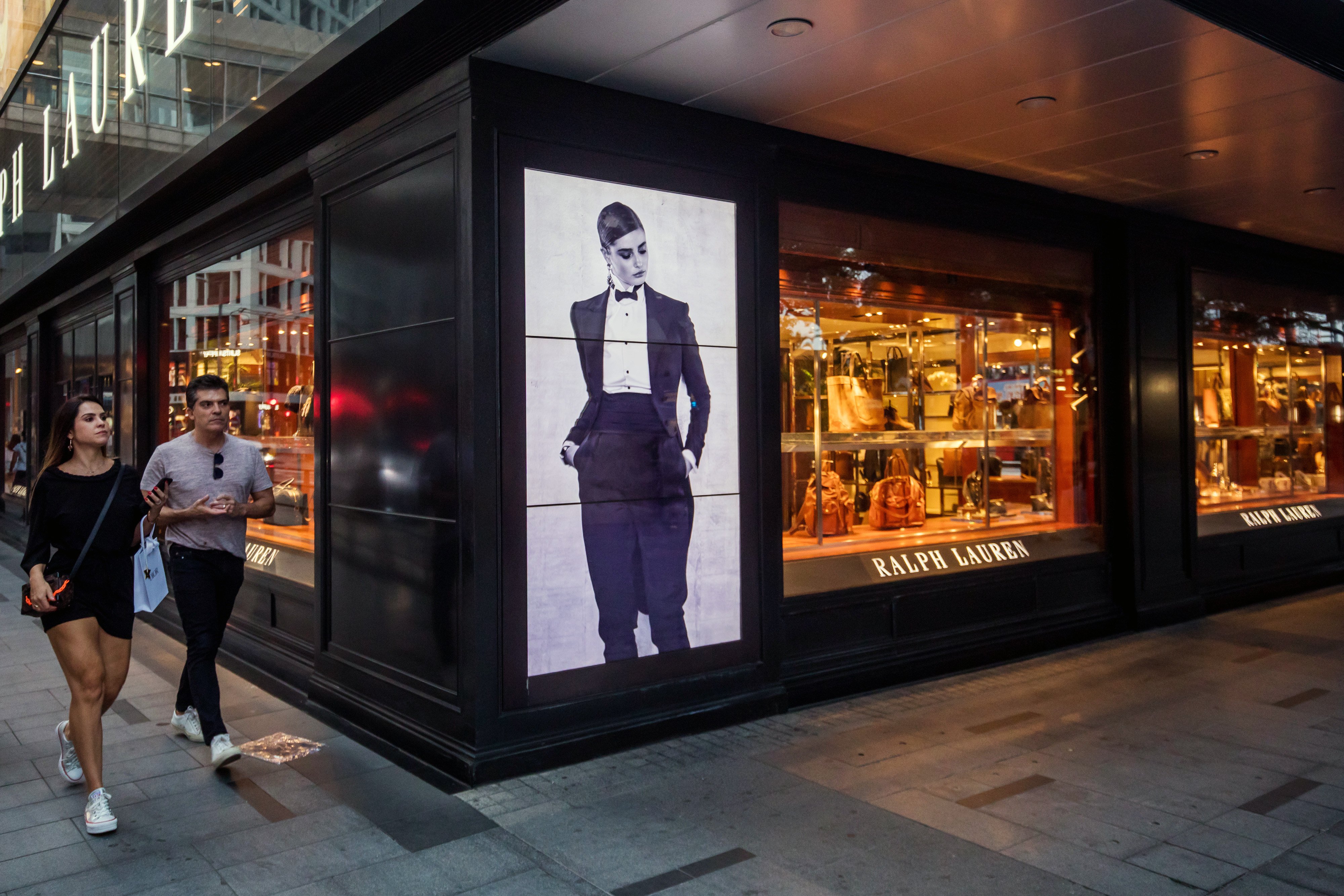 Pedestrians walk past a Ralph Lauren Corp. store in the Central district of Hong Kong, China. Photo: Bloomberg