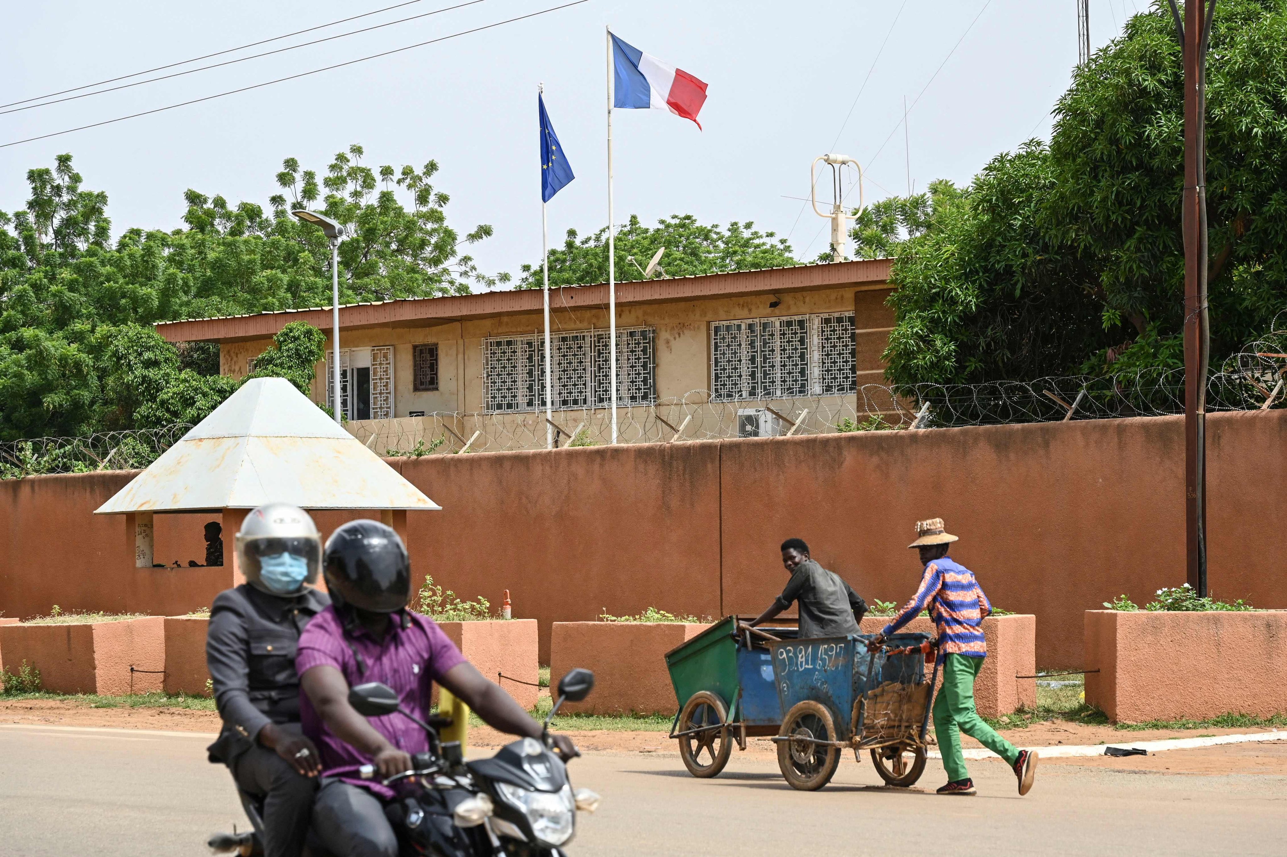 People walk past the French Embassy building in Niamey, Niger on September 7, 2023. Photo: AFP