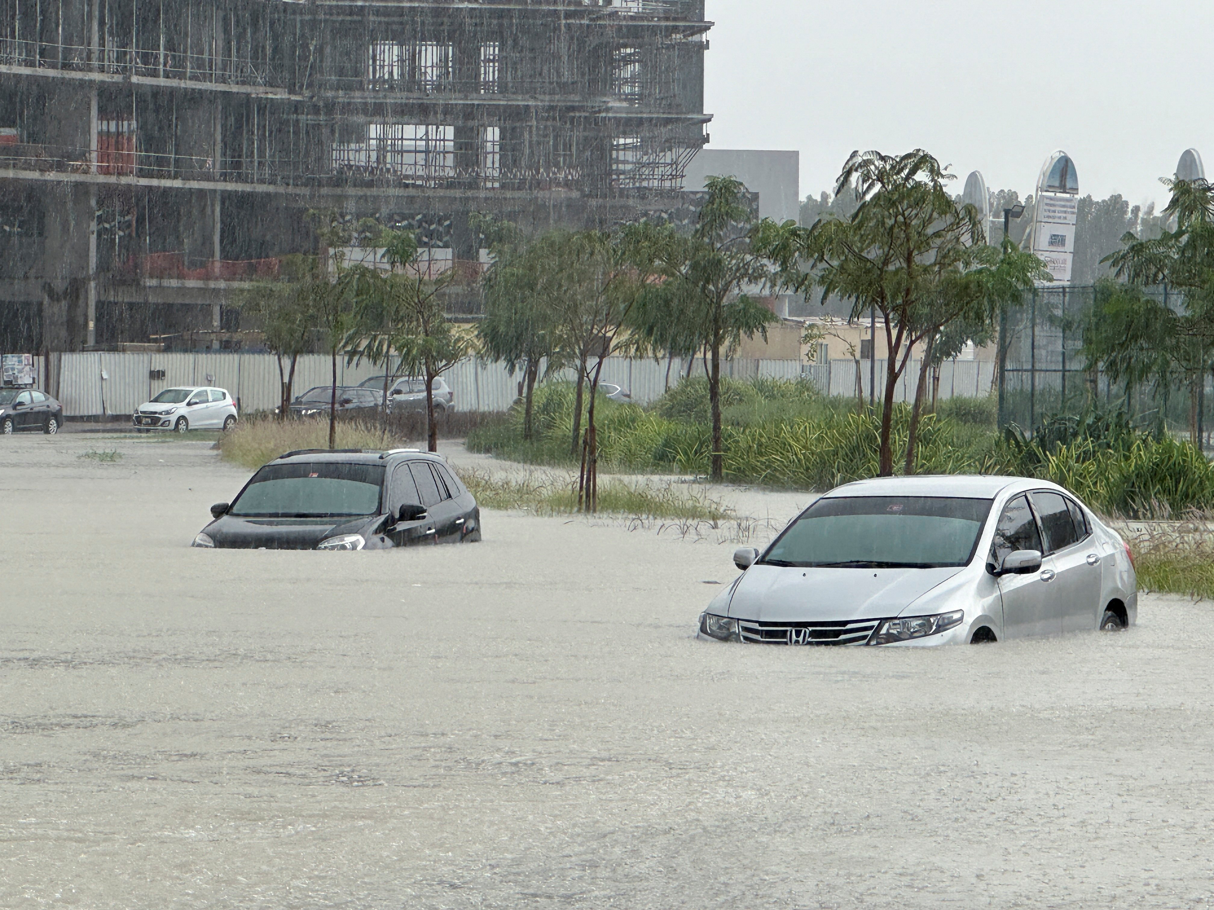 Cars in a flooded street in Dubai on Tuesday. Photo: Reuters