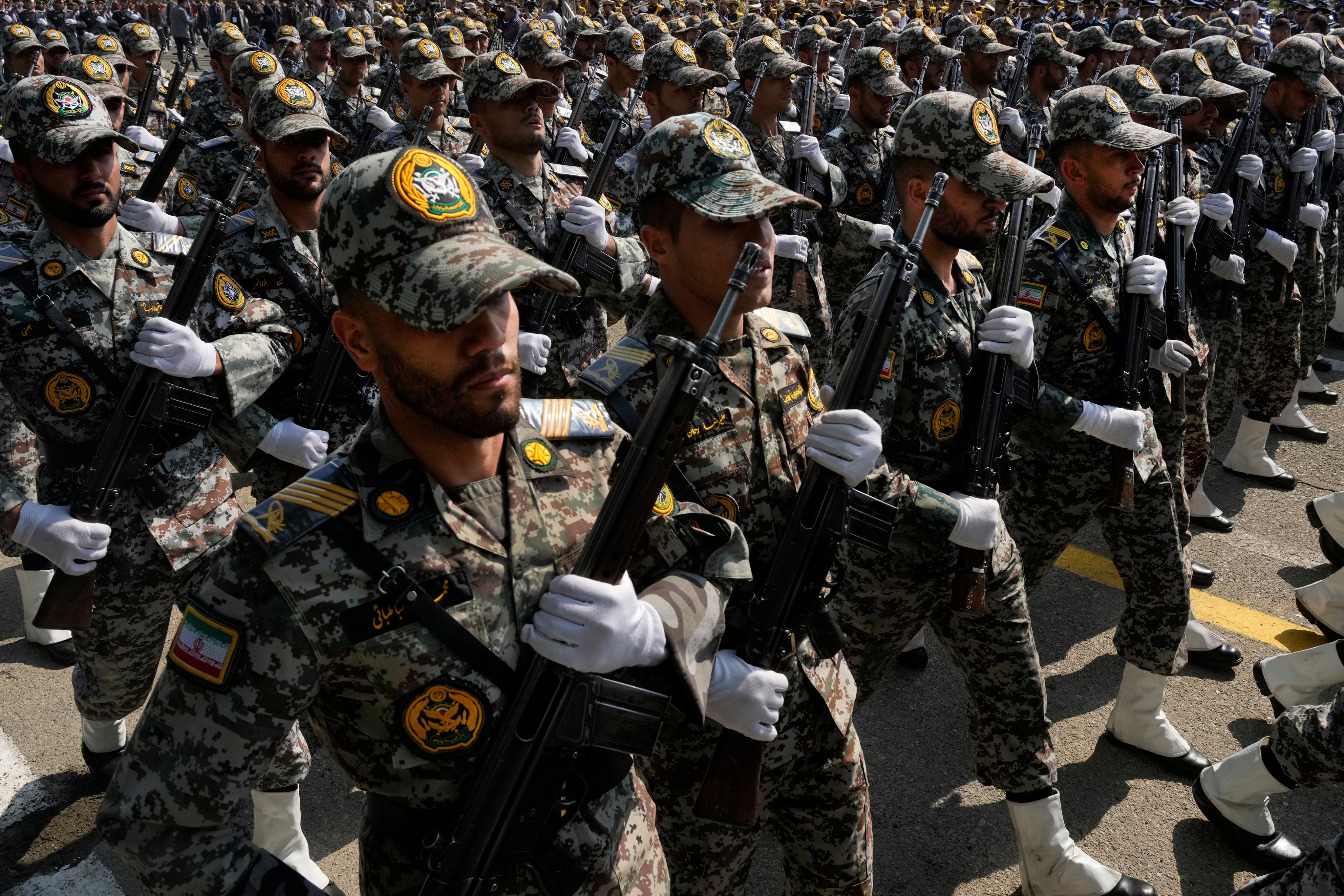 Members of the Iranian military march during an Army Day parade in Tehran on April 17. During the parade, President Ebrahim Raisi said the “tiniest invasion” by Israel would bring a “massive and harsh” response, as the region braces for further escalation. Photo: AP