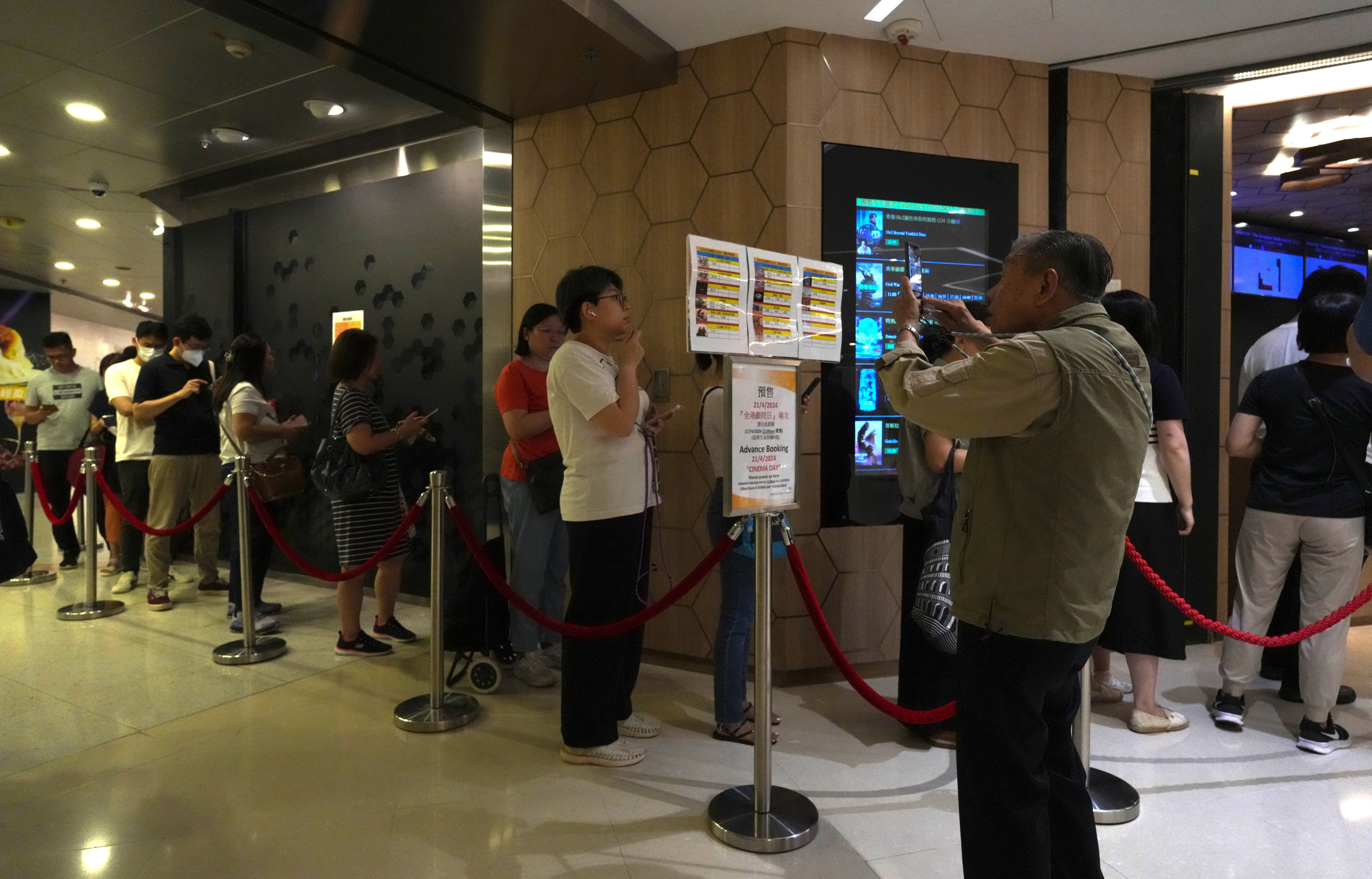 People queue up to buy movie tickets outside a cinema in Kornhill Plaza. Photo: May Tse
