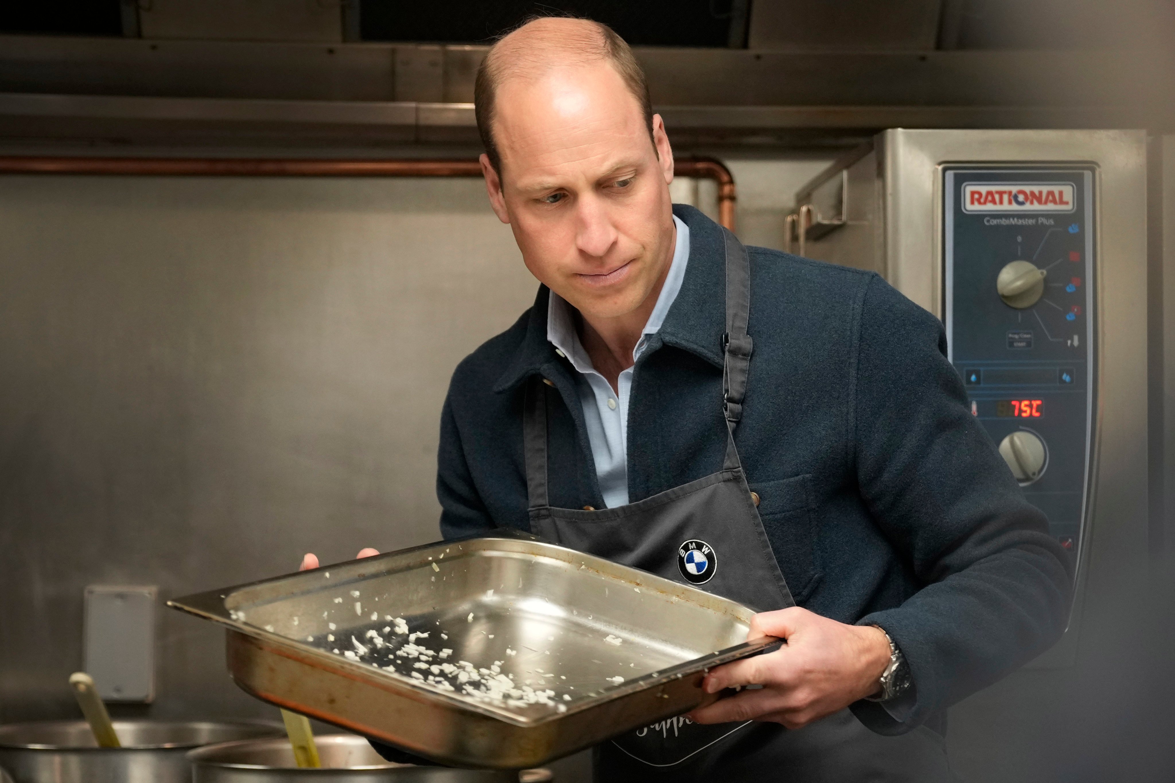 The Prince visited a surplus food redistribution charity, to learn about its work bridging the gap between food waste and food poverty across Surrey and West London. Photo: AP/Pool