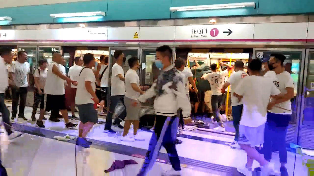 A mob of men in white shirts attacked black-clad protesters and passengers at Yuen Long MTR Station in 2019. Photo: Handout