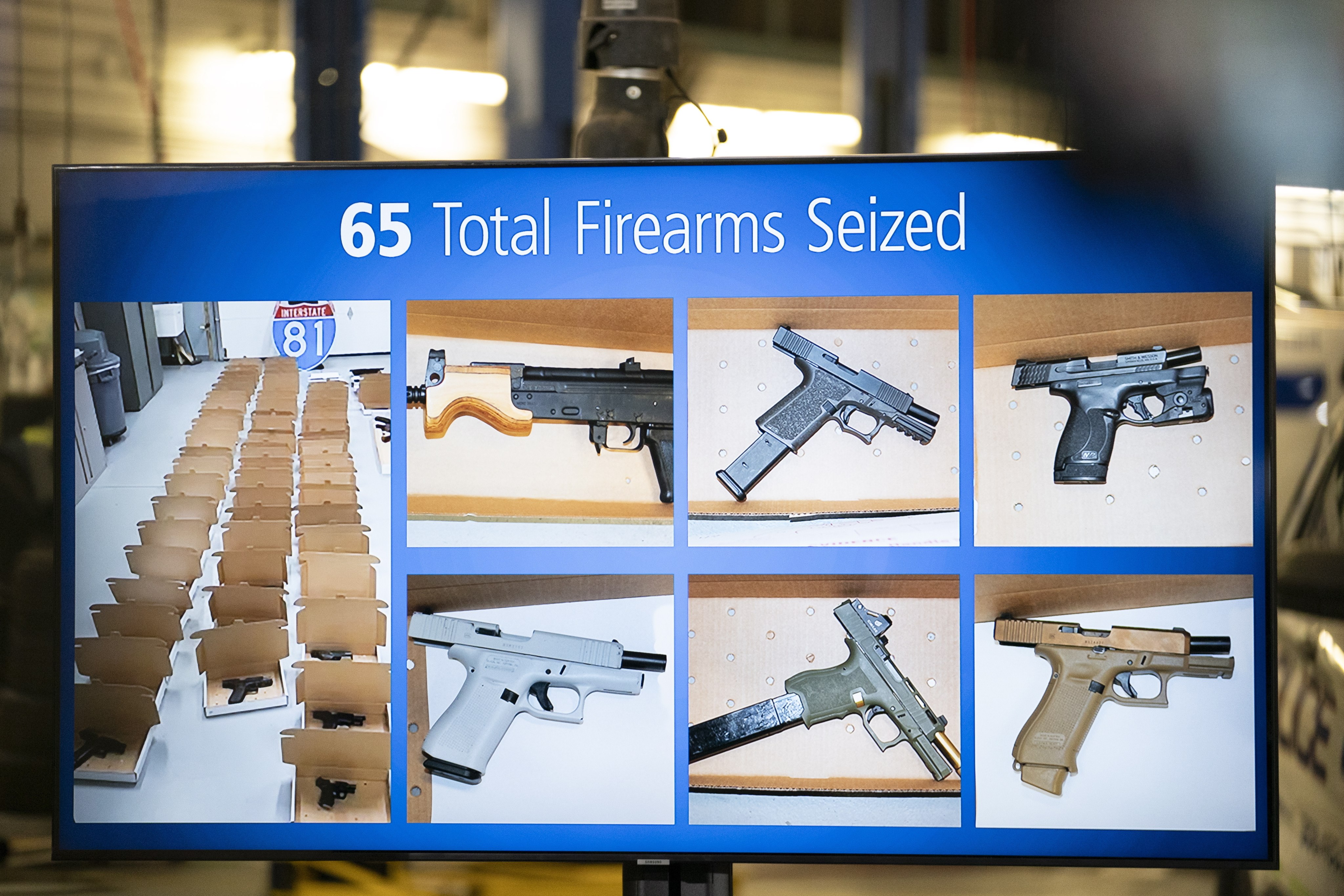 Photos of firearms seized are displayed during a news conference in Brampton, Ontario, Canada on Wednesday. Photo: Canadian Press via AP