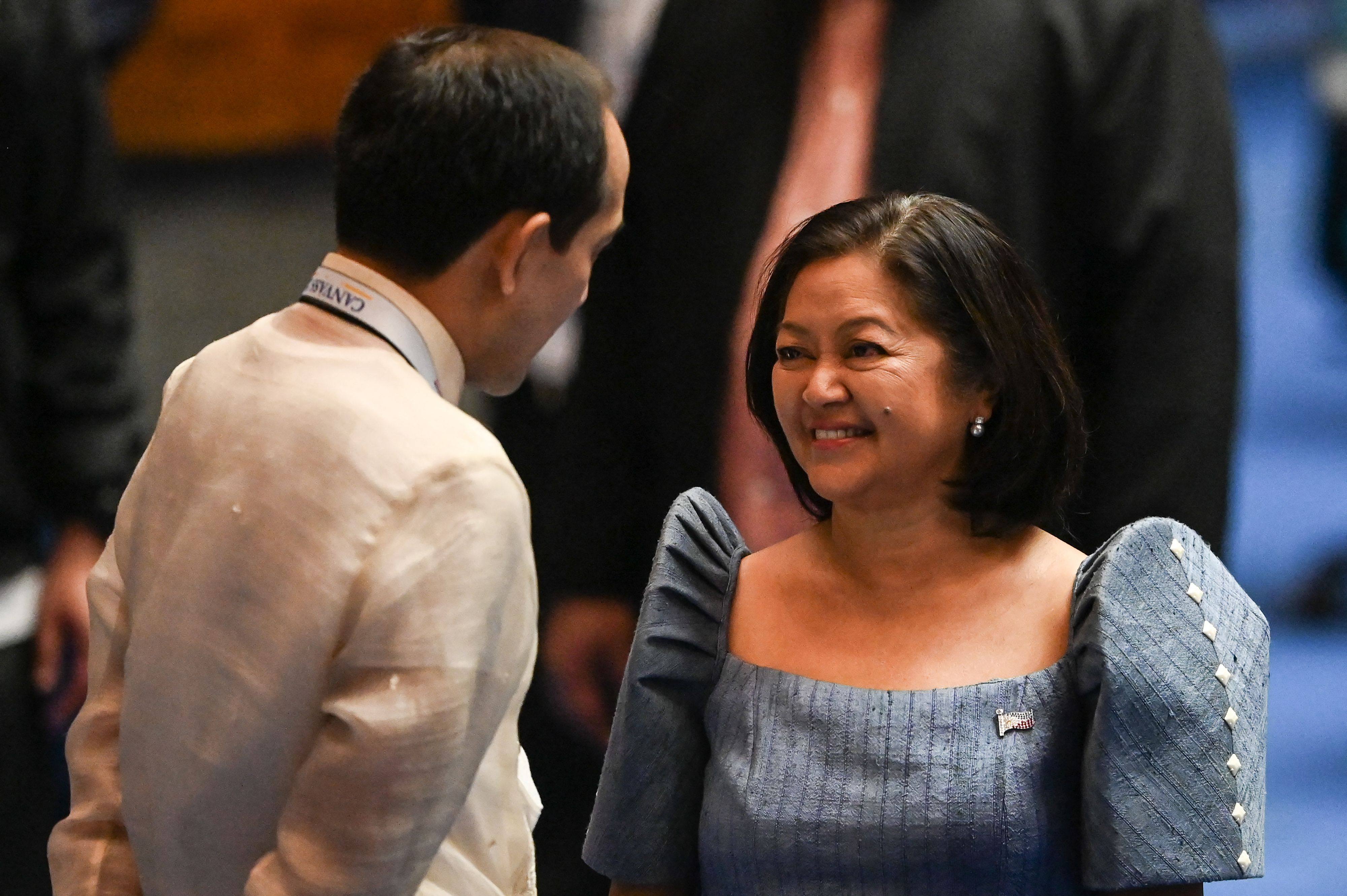 First lady Louise Araneta-Marcos chats during the presidential proclamation at the House of Representatives. In an interview, the first lady says she was “always kind to [the vice-president]” but the vice-president was “now a bad shot with me”. Photo: AFP