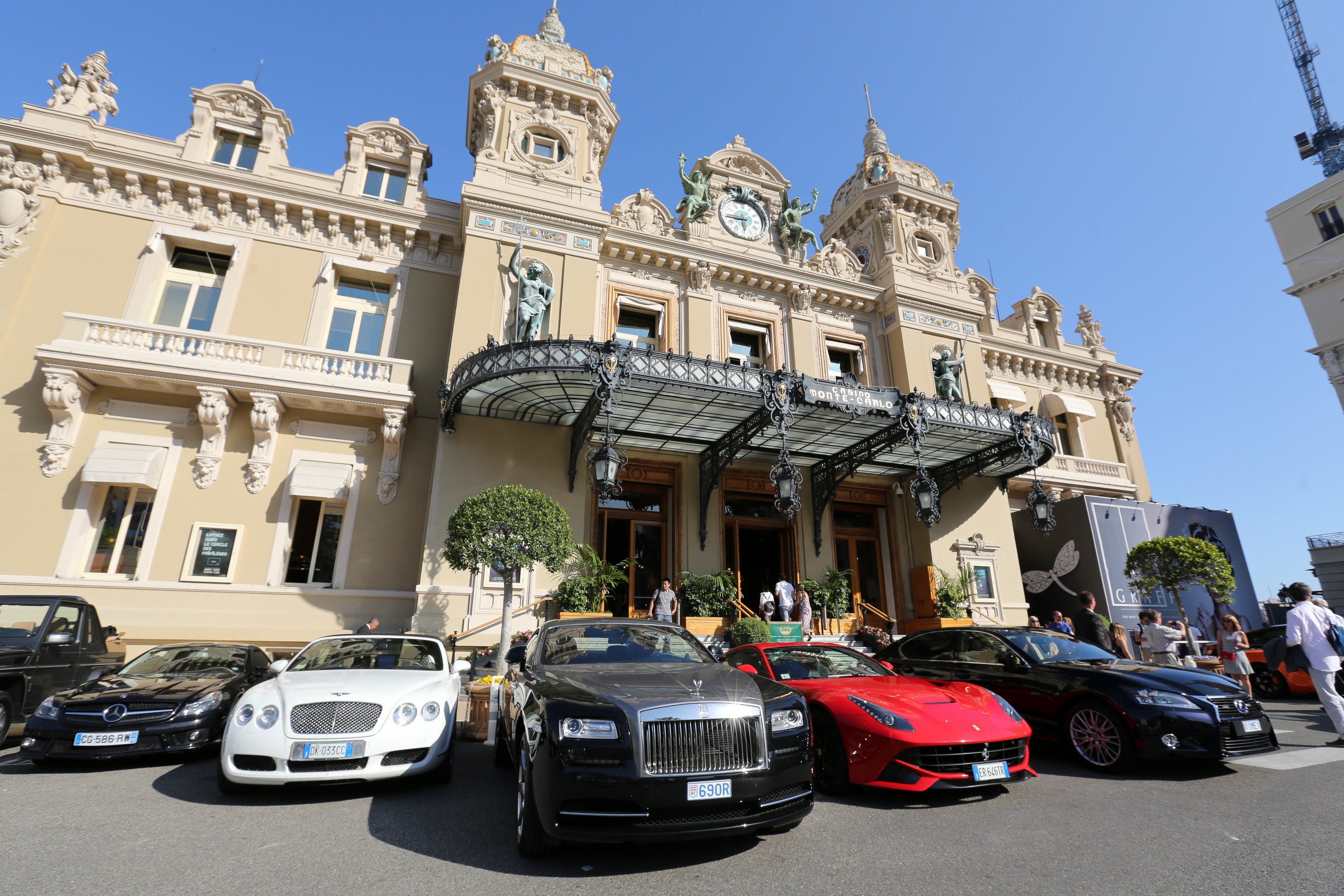 Luxury cars are parked outside the Casino de Monte-Carlo in Monaco. The principality is courting investment from Asia’s wealthy. Photo: Bloomberg