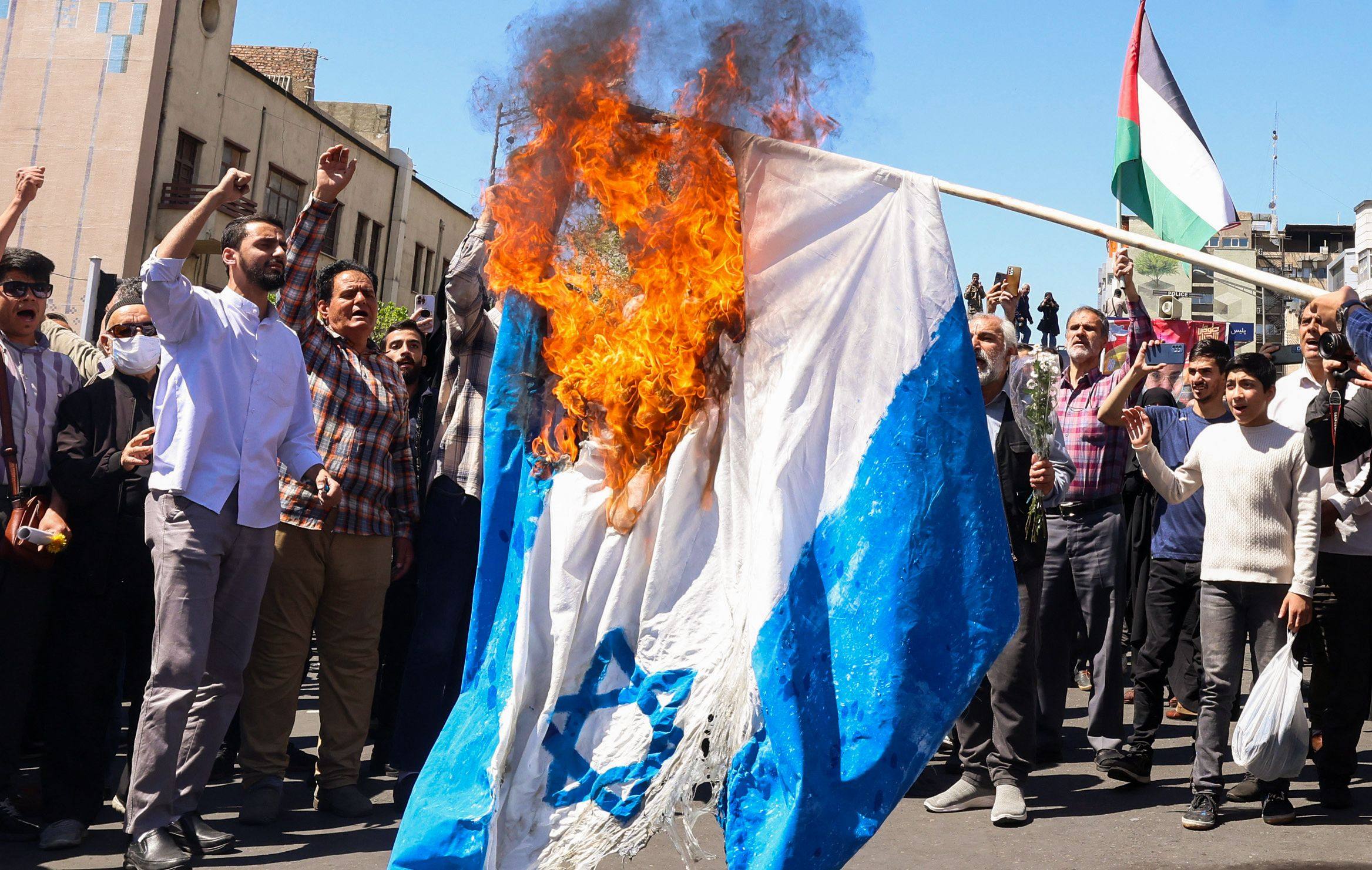 An Israeli flag being burnt during the funeral for seven Islamic Revolutionary Guard Corps members killed in a strike in Syria, which Iran blamed on Israel, in Tehran on April 5. Photo: AFP