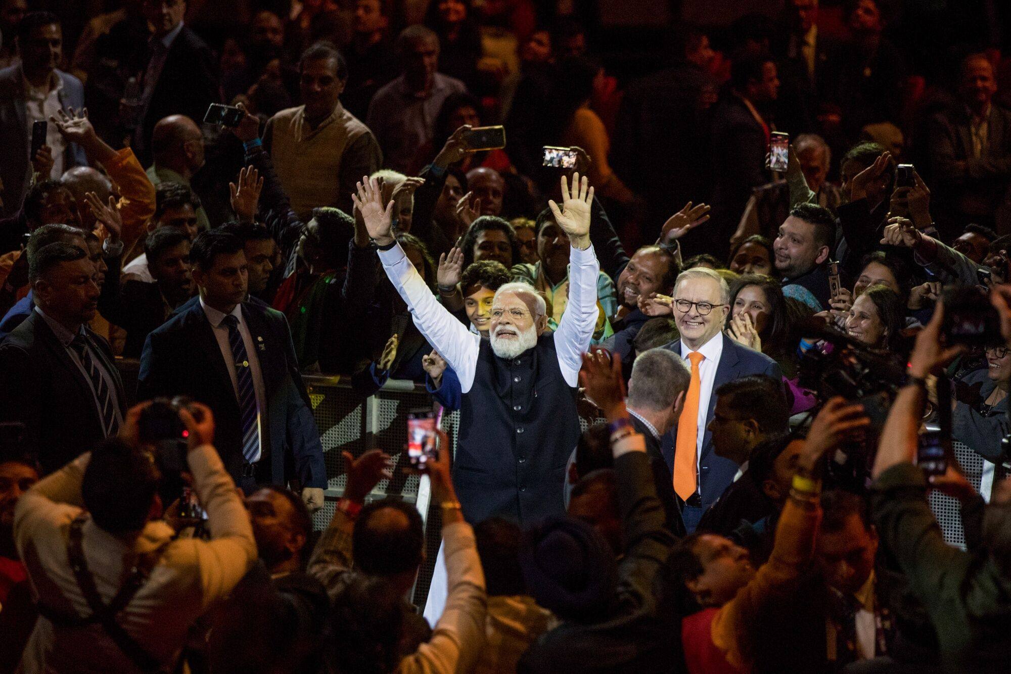 Indian Prime Minister Narendra Modi gestures to the crowd alongside his Australian counterpart Anthony Albanese (centre, right) in Sydney last year attended by thousands of expatriate Indians. Photo: Bloomberg