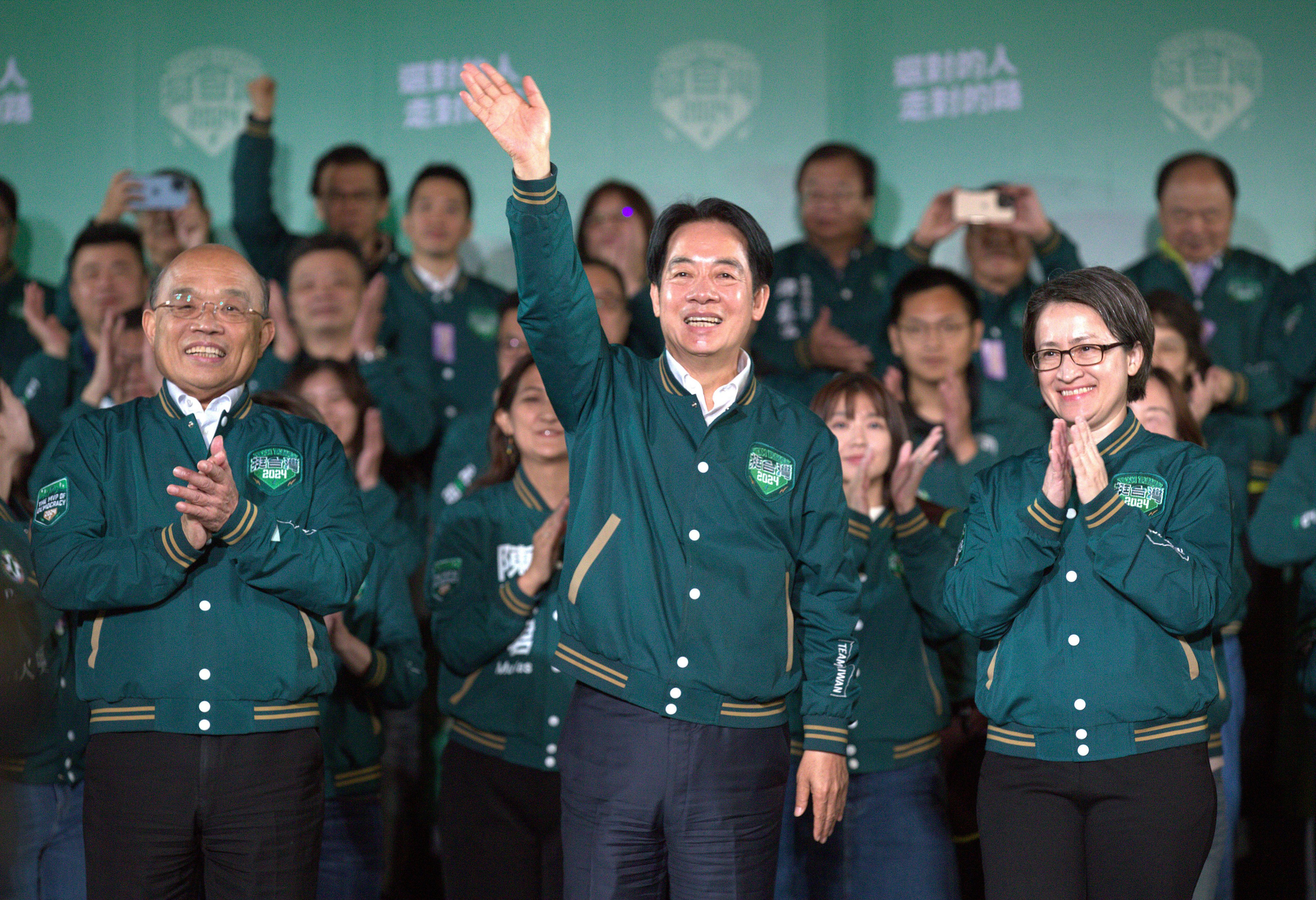 William Lai Ching-te celebrates his victory with running mate Bi-khim Hsiao and supporters, in Taipei on January 13. He takes office as president on May 20. Photo: AP