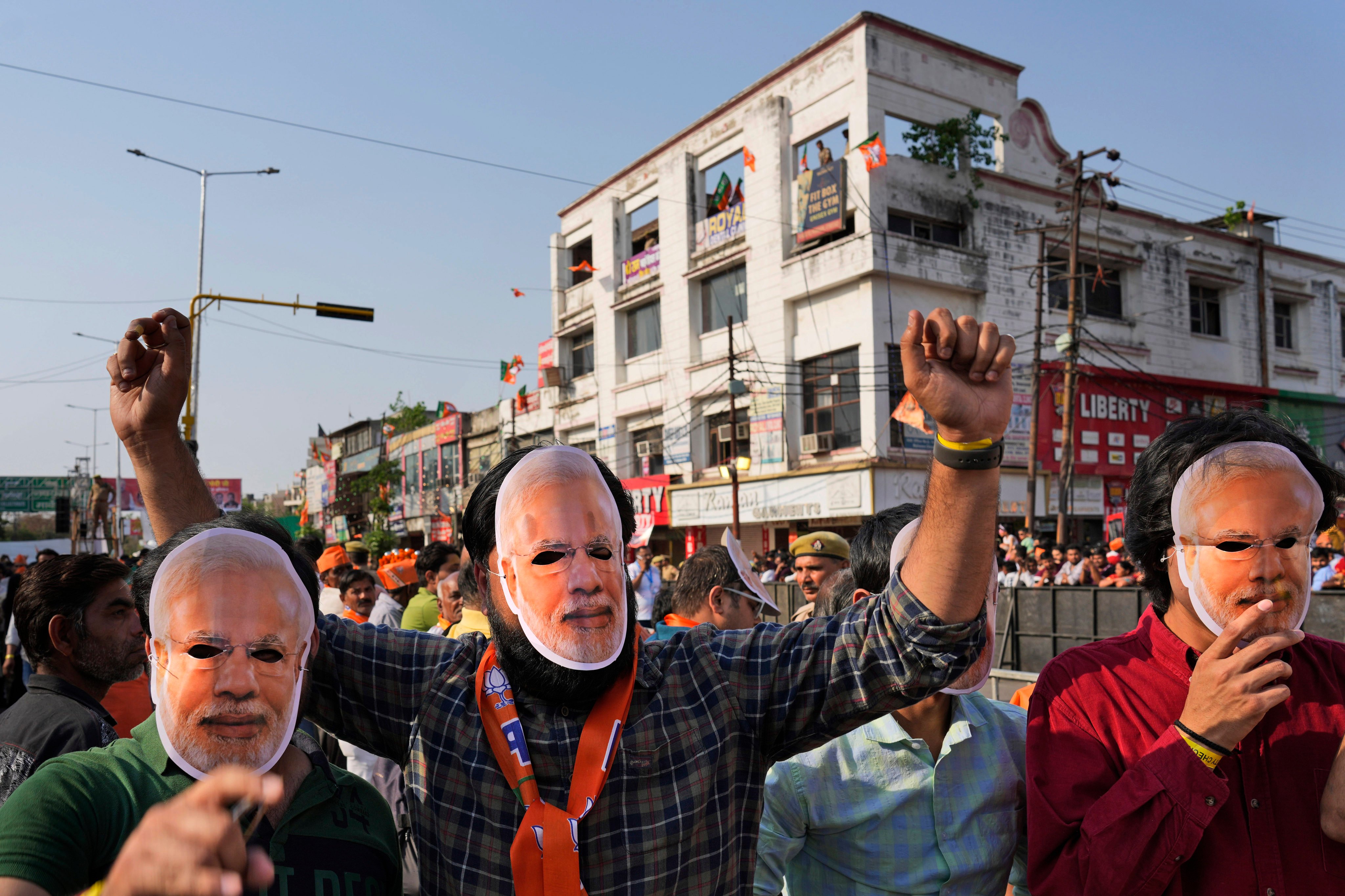 Supporters of Bharatiya Janata Party wear masks of Indian Prime Minister Narendra Modi at an election campaign in Ghaziabad. Modi and his ruling Bharatiya Janata Party are the favourites to win a high-stakes parliamentary election, analysts say. Photo: AP