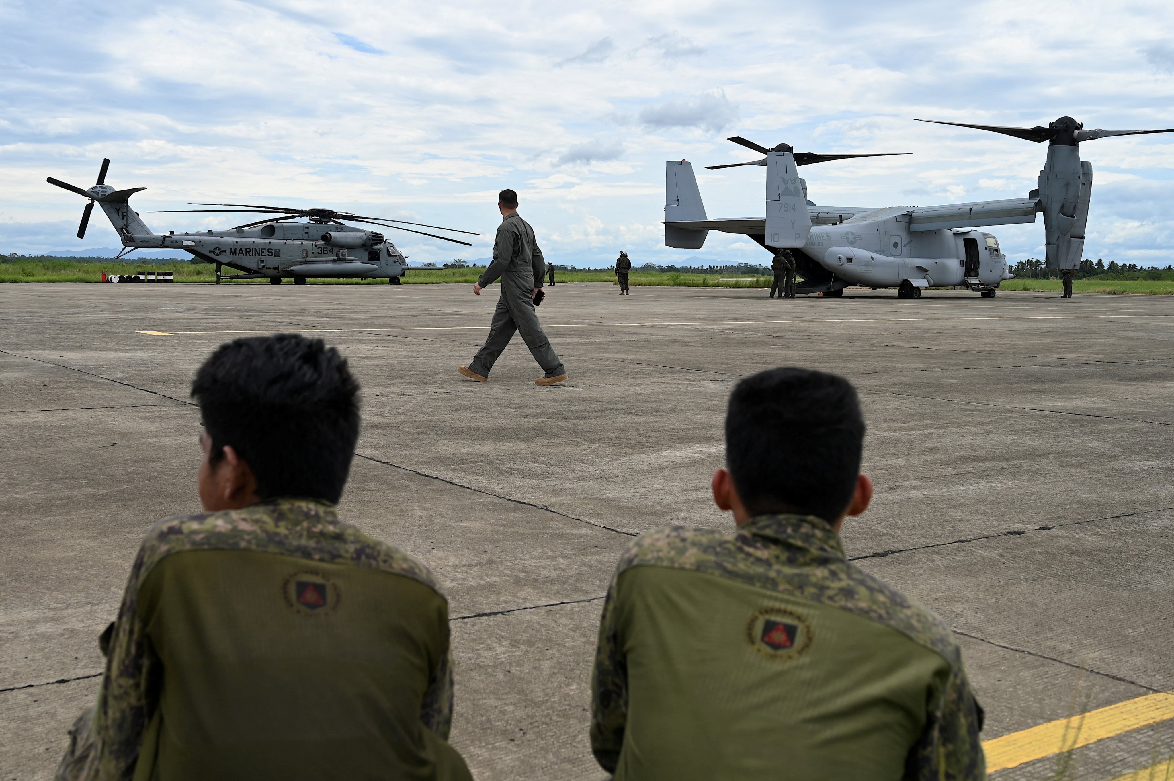 Soldiers watch US aircraft at Lal-lo Airport in Cagayan province, northern Philippines. Some Philippine lawmakers expressed alarm over the some 4,000 non-local students in the province that also houses military bases accessed by US troops. Photo: Reuters