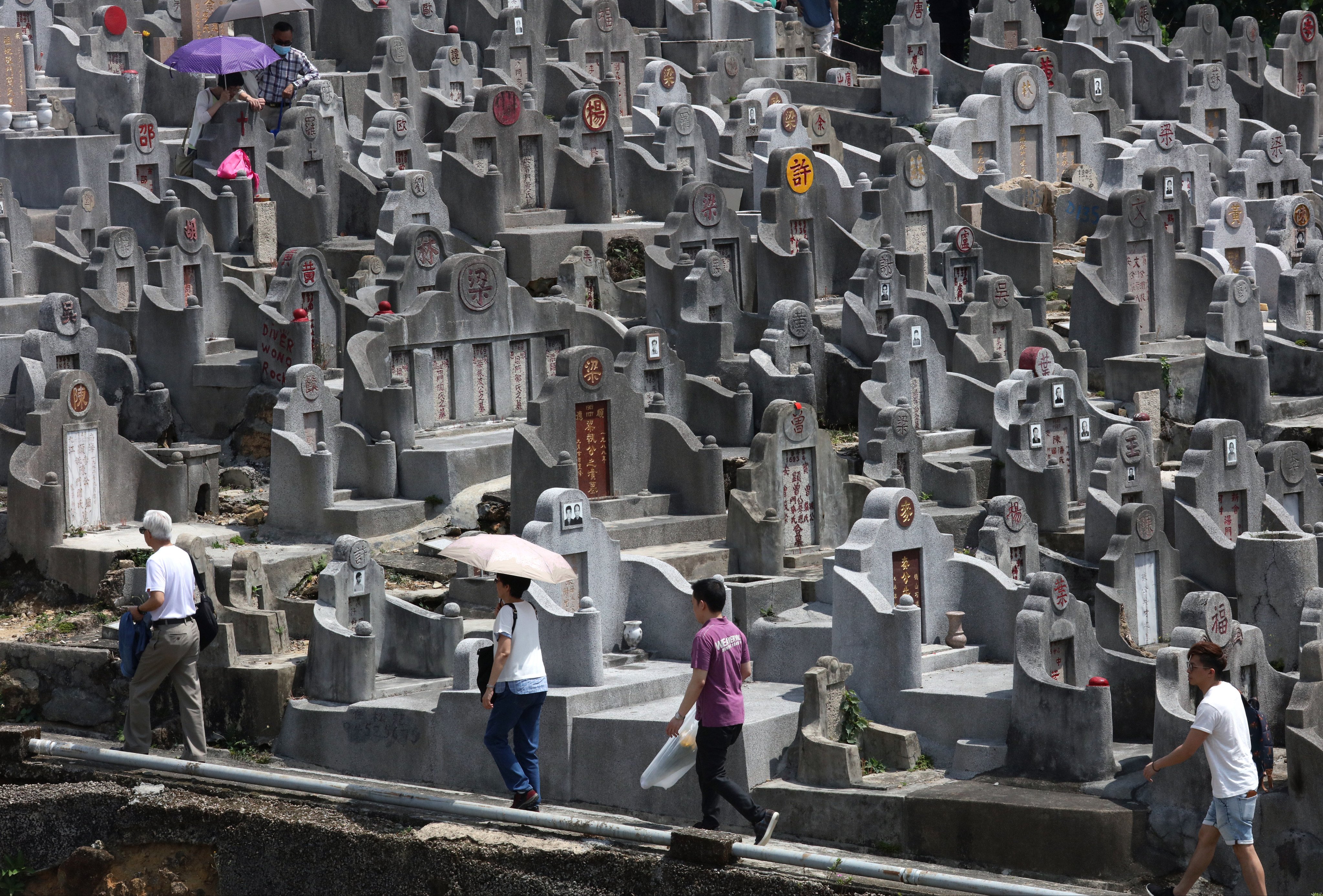 People at the cemetery in Diamond Hill during the Ching Ming Festival in April 2018. Long waiting times at cemeteries and public columbariums have made the idea of scattering the ashes of loved ones in designated gardens or at sea more popular. Felix Wong